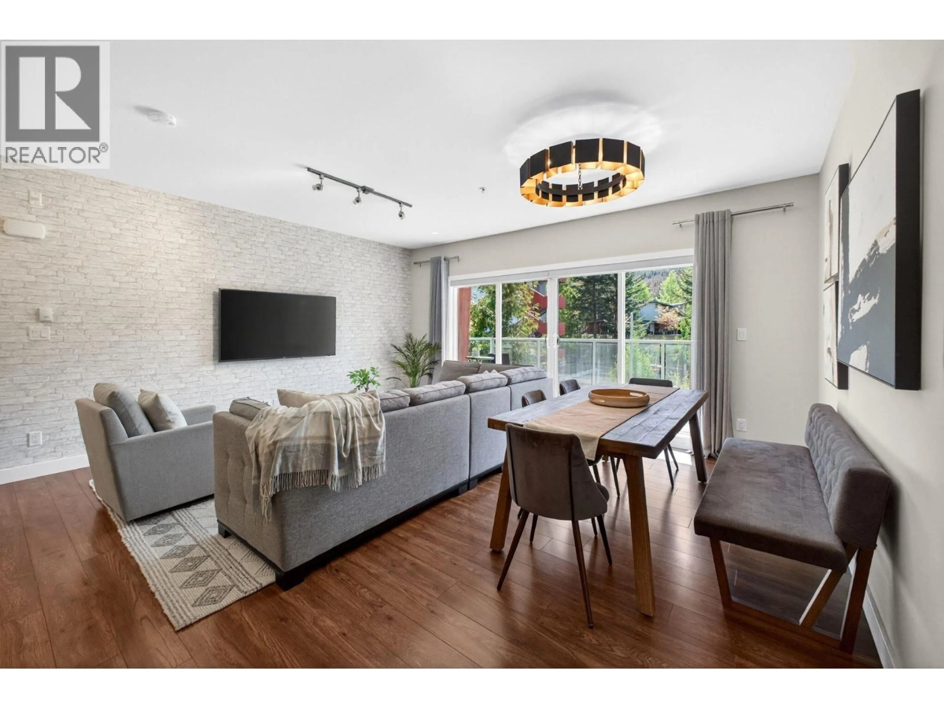 Living room with furniture, wood/laminate floor for 212 - 1025 LEGACY WAY, Whistler British Columbia V8E0S2
