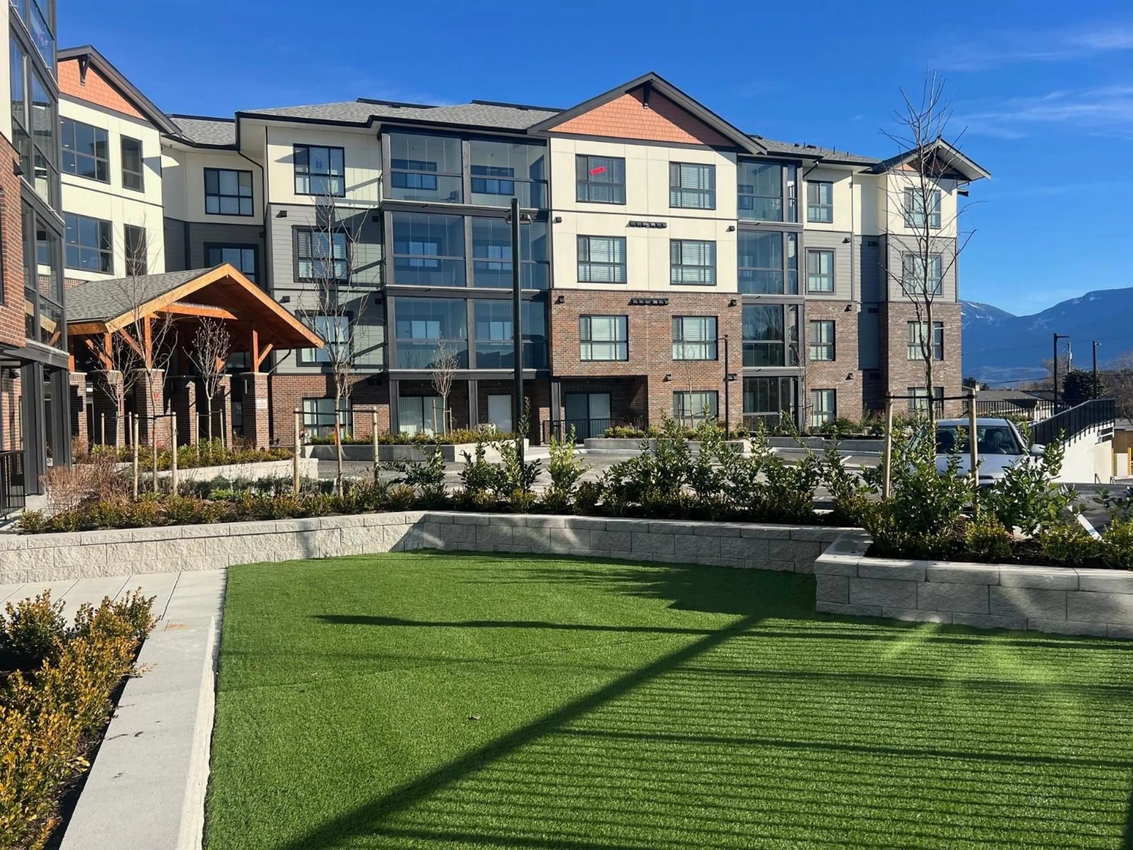 A pic from outside/outdoor area/front of a property/back of a property/a pic from drone, unknown for 332 - 8497 YOUNG ROAD, Chilliwack British Columbia V2P4P2