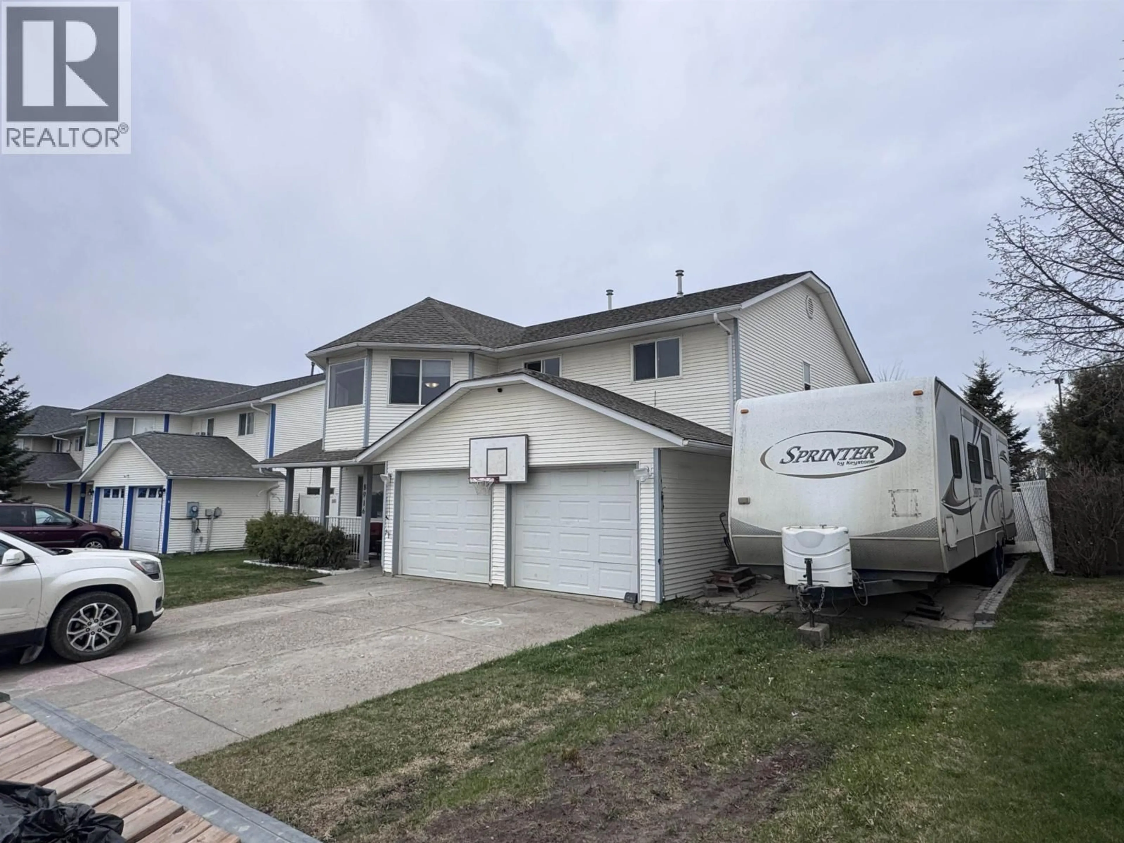 Home with vinyl exterior material, street for 8916 84A STREET, Fort St. John British Columbia V1J6T1