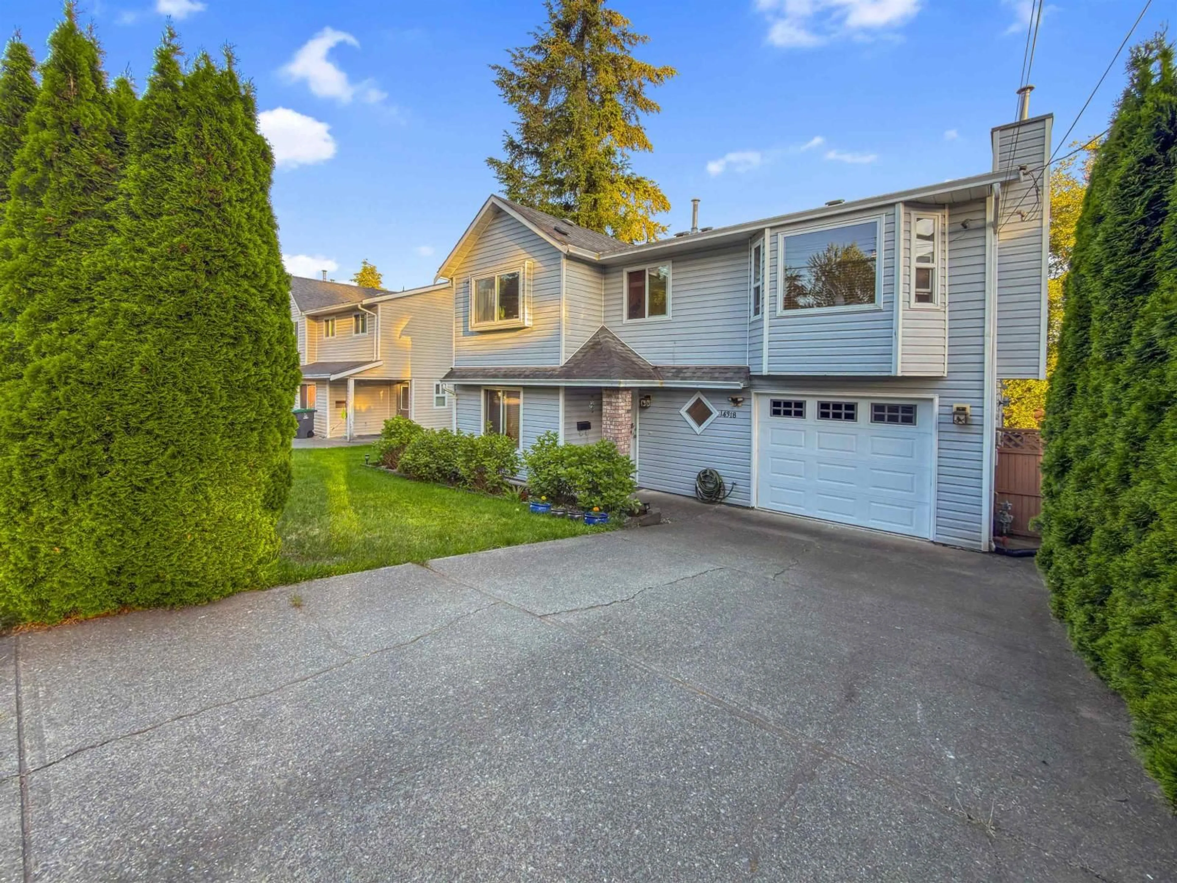 Home with vinyl exterior material, street for 14318 68 AVE, Surrey British Columbia V3W2H4