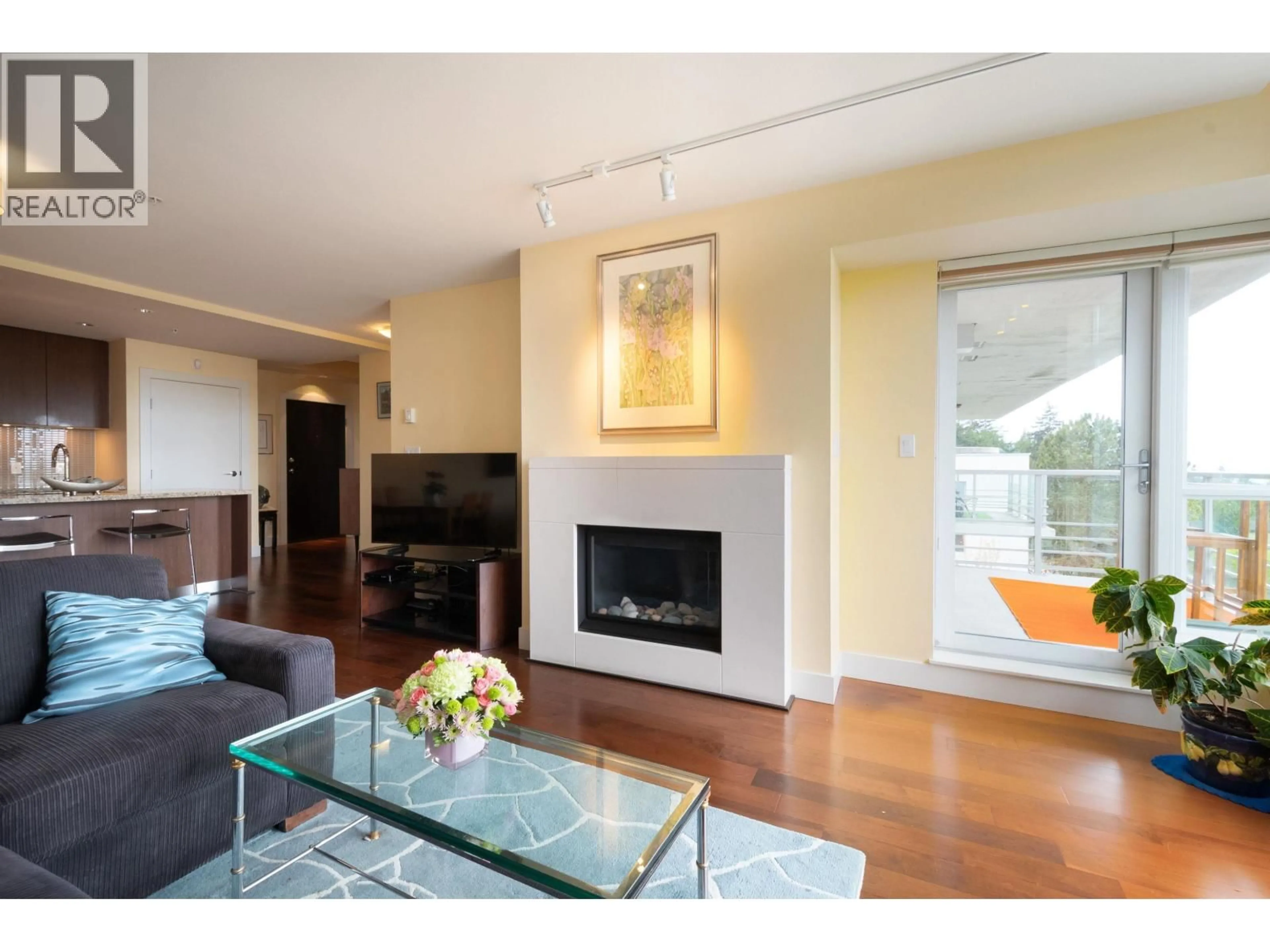 Living room with furniture, wood/laminate floor for 604 - 6080 IONA DRIVE, Vancouver British Columbia V6T0A4