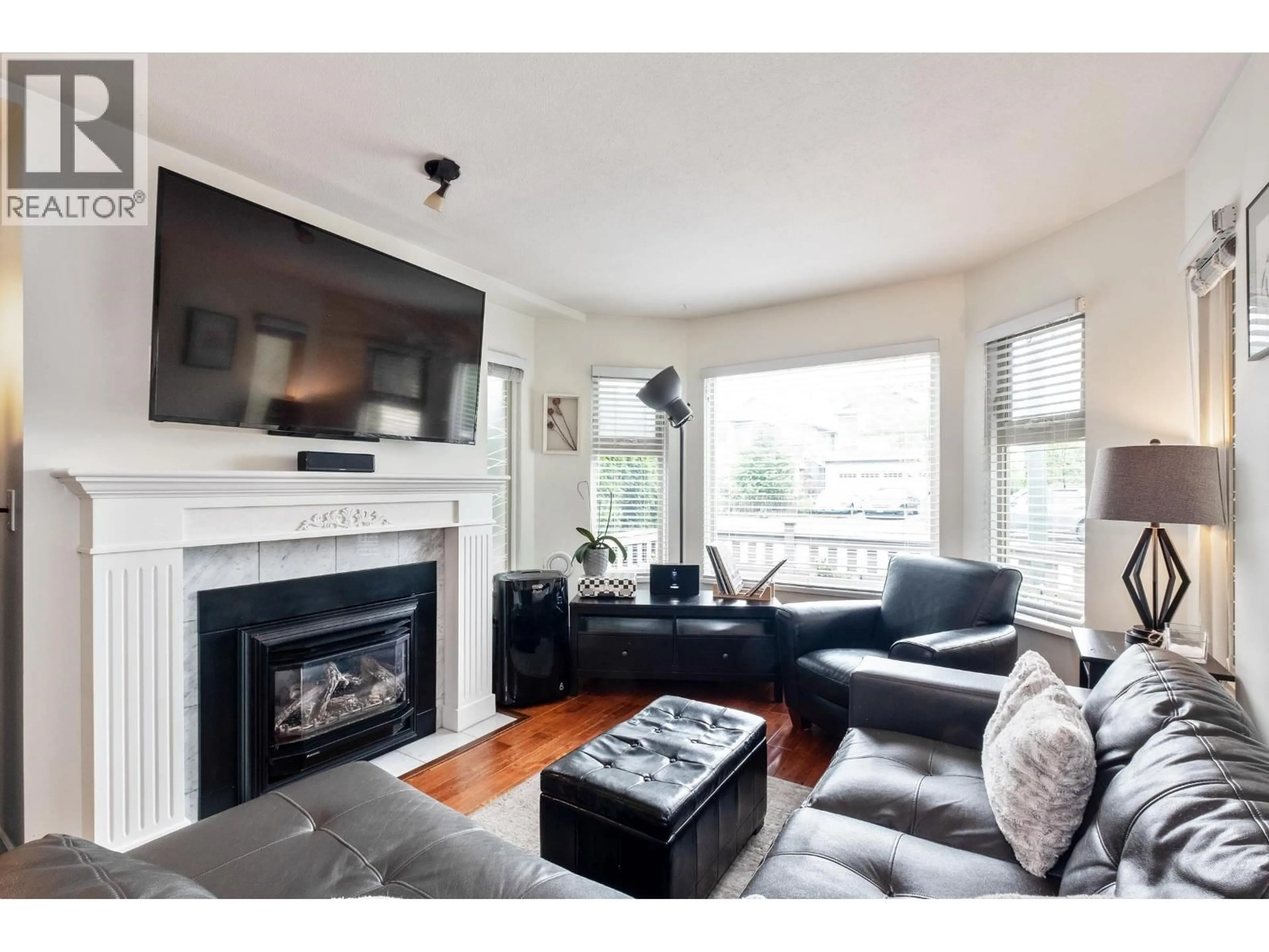 Living room with furniture, wood/laminate floor for C101 - 4831 53 STREET, Delta British Columbia V4K2Z3