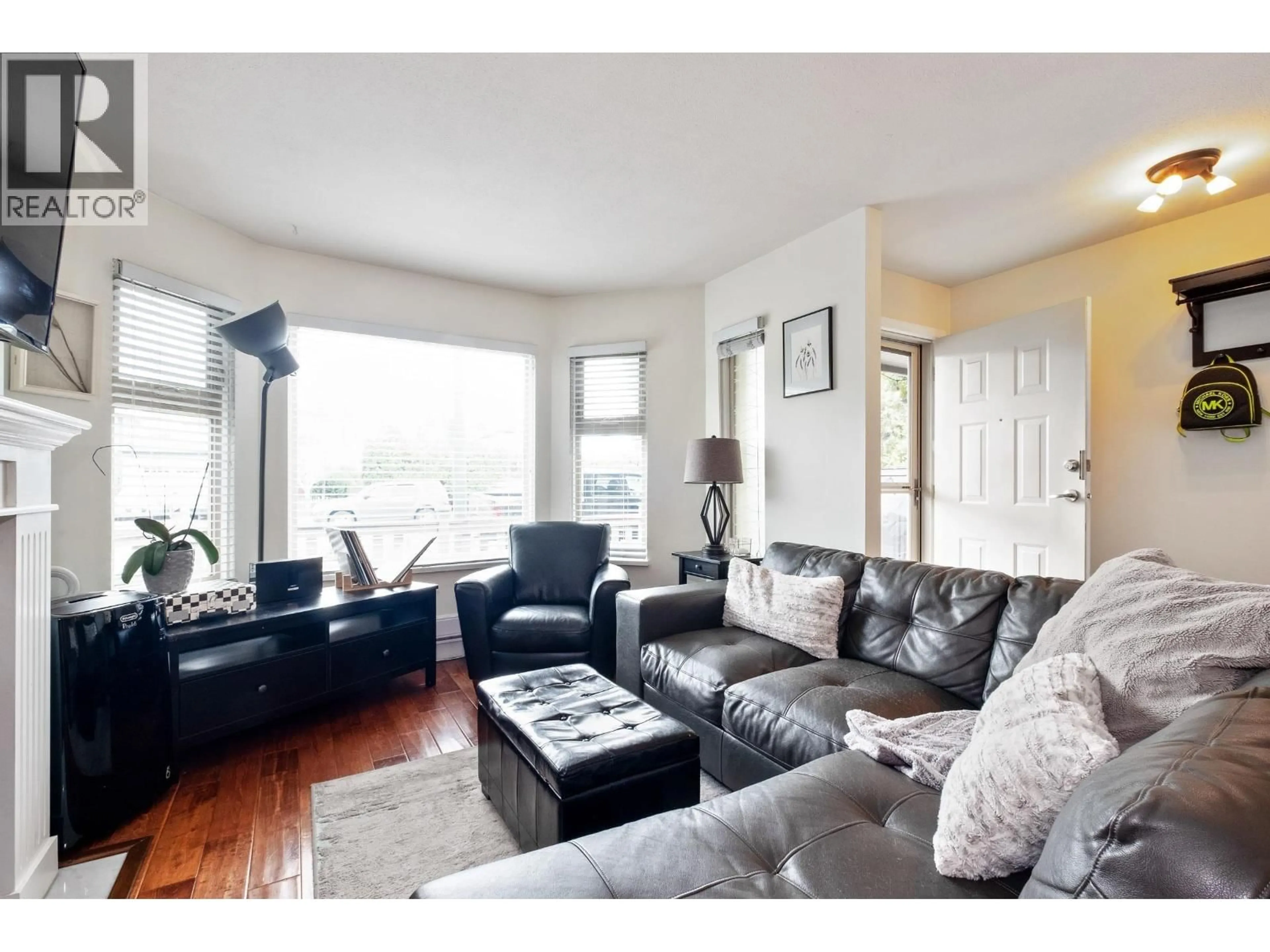 Living room with furniture, wood/laminate floor for C101 - 4831 53 STREET, Delta British Columbia V4K2Z3