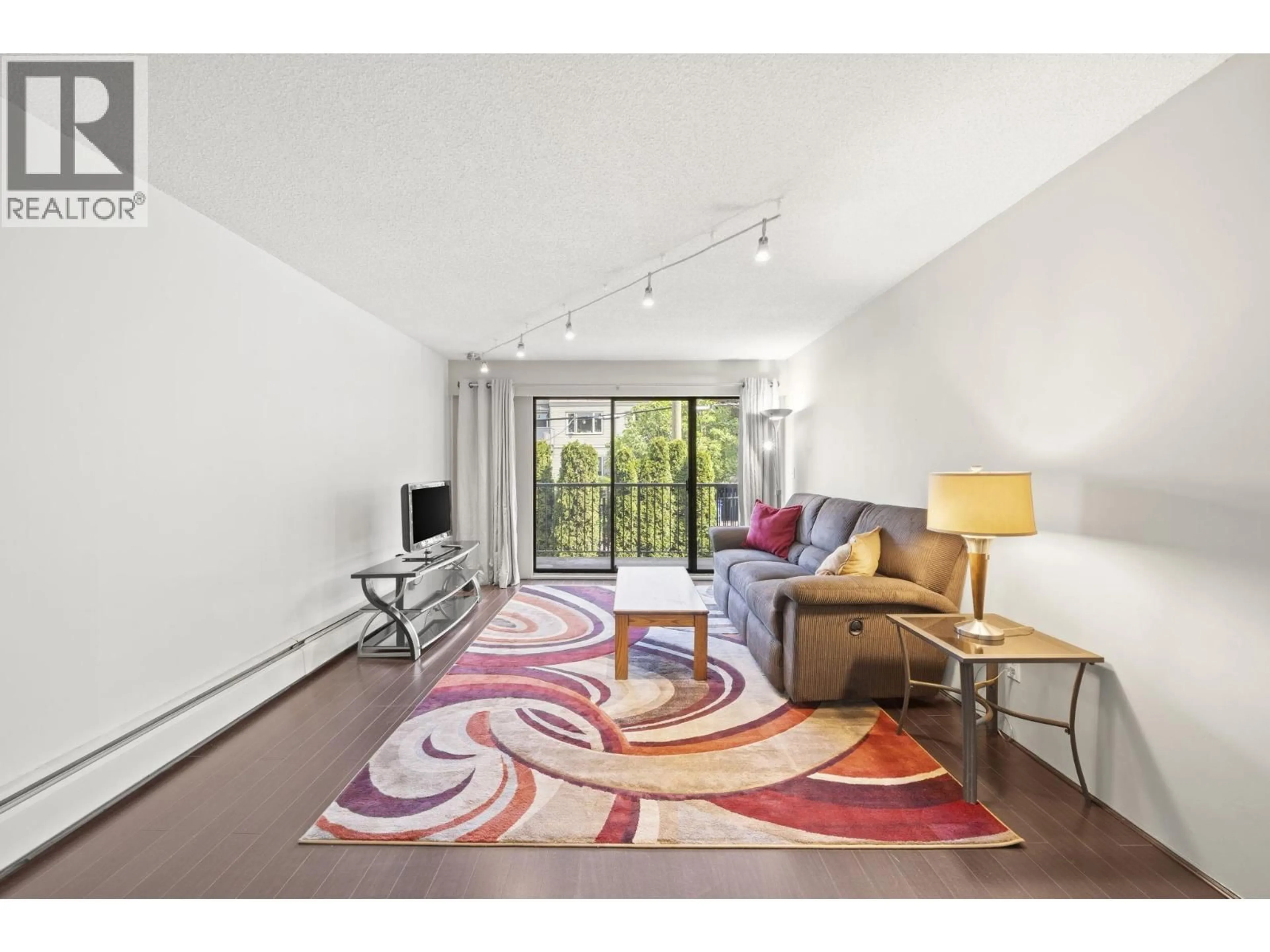 Living room with furniture, carpet floor for 205 - 1585 4TH AVENUE, Vancouver British Columbia V5N1J9