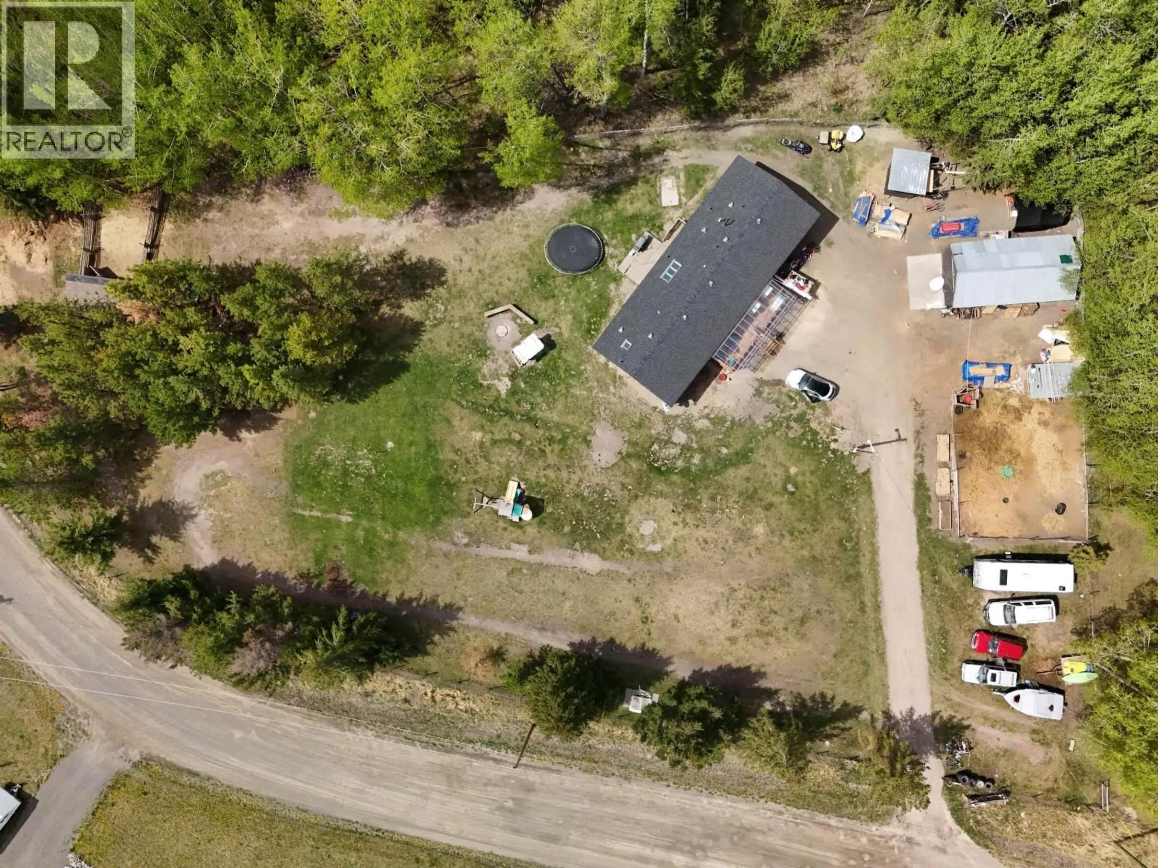 A pic from outside/outdoor area/front of a property/back of a property/a pic from drone, street for 6480 MESSNER ROAD, 100 Mile House British Columbia V0K2E3