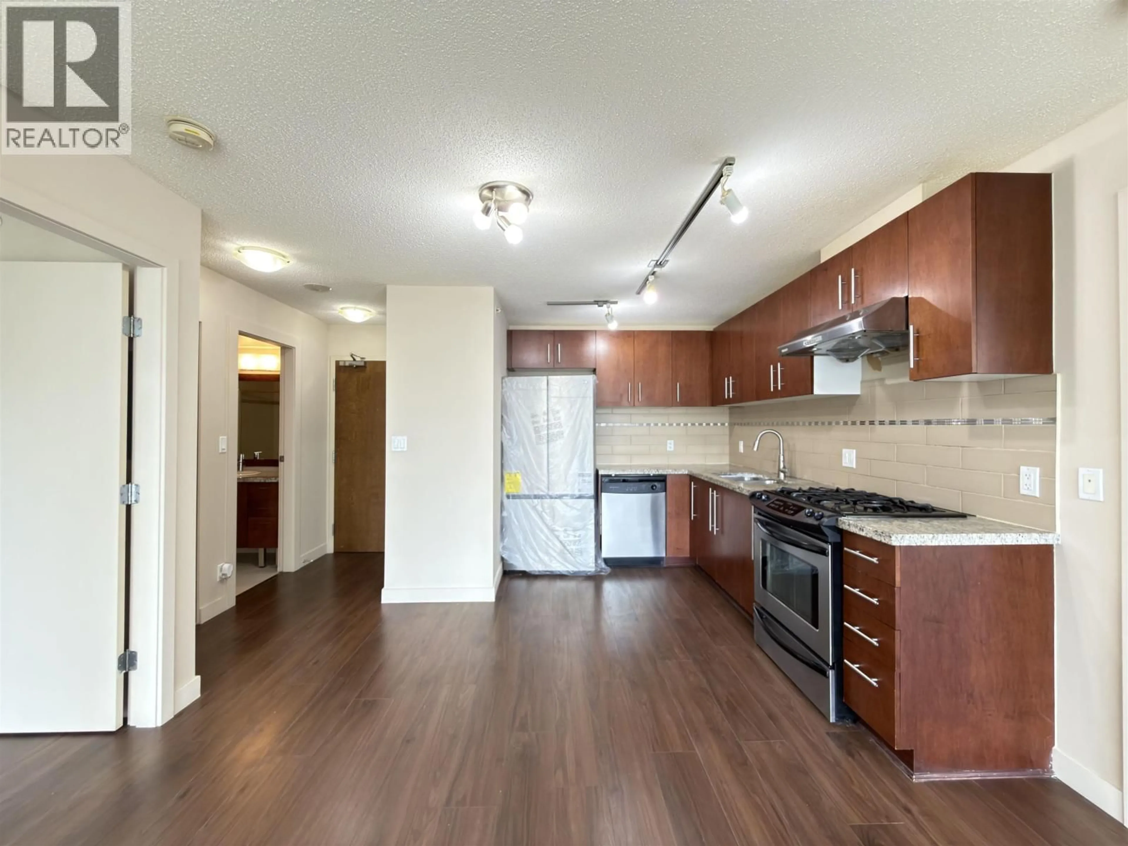 Open concept kitchen, wood/laminate floor for 808 - 8280 LANSDOWNE ROAD, Richmond British Columbia V6X0B2