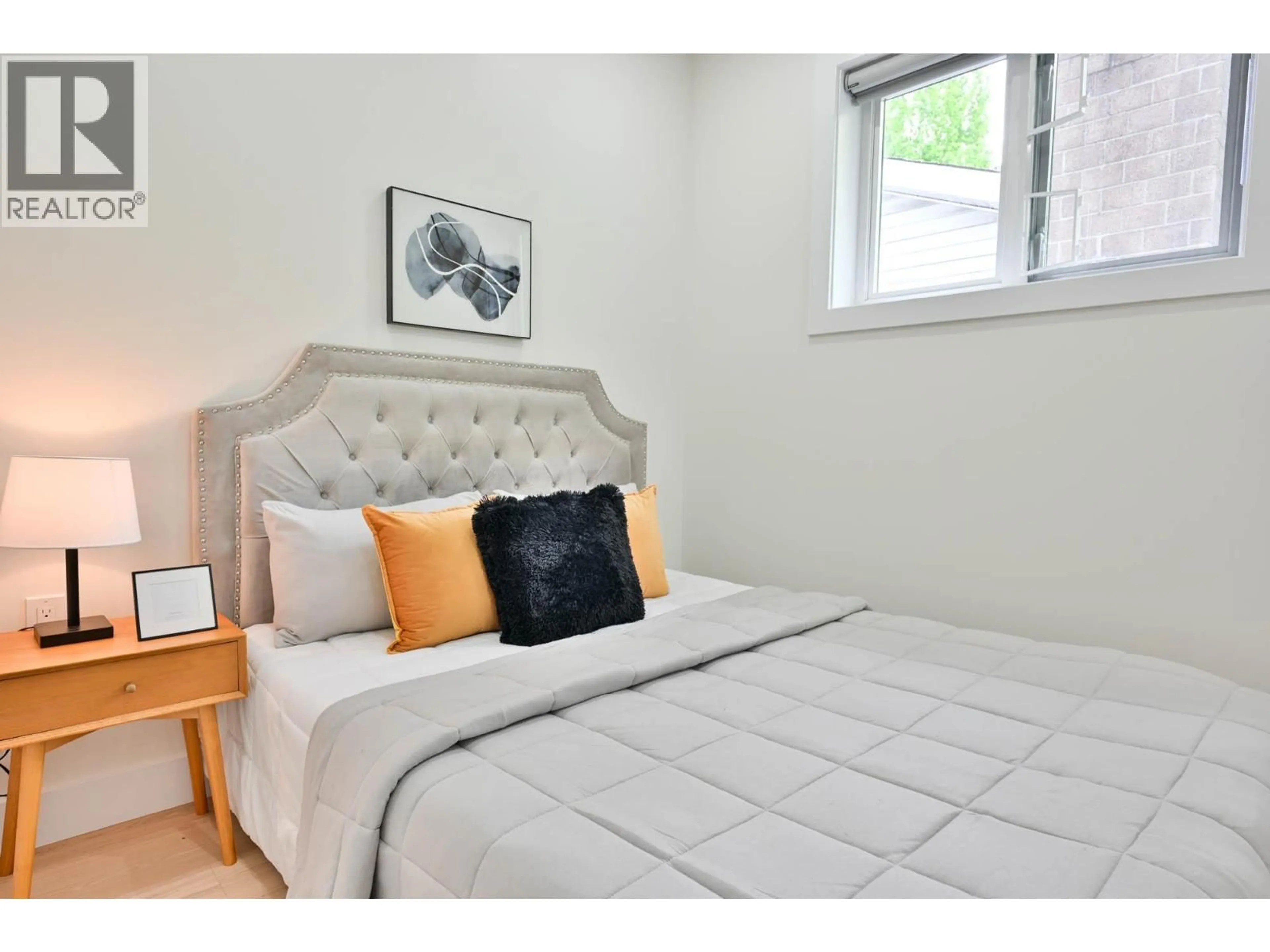 Bedroom with bed, wood/laminate floor for 4874-A LANARK STREET, Vancouver British Columbia V5N3S2