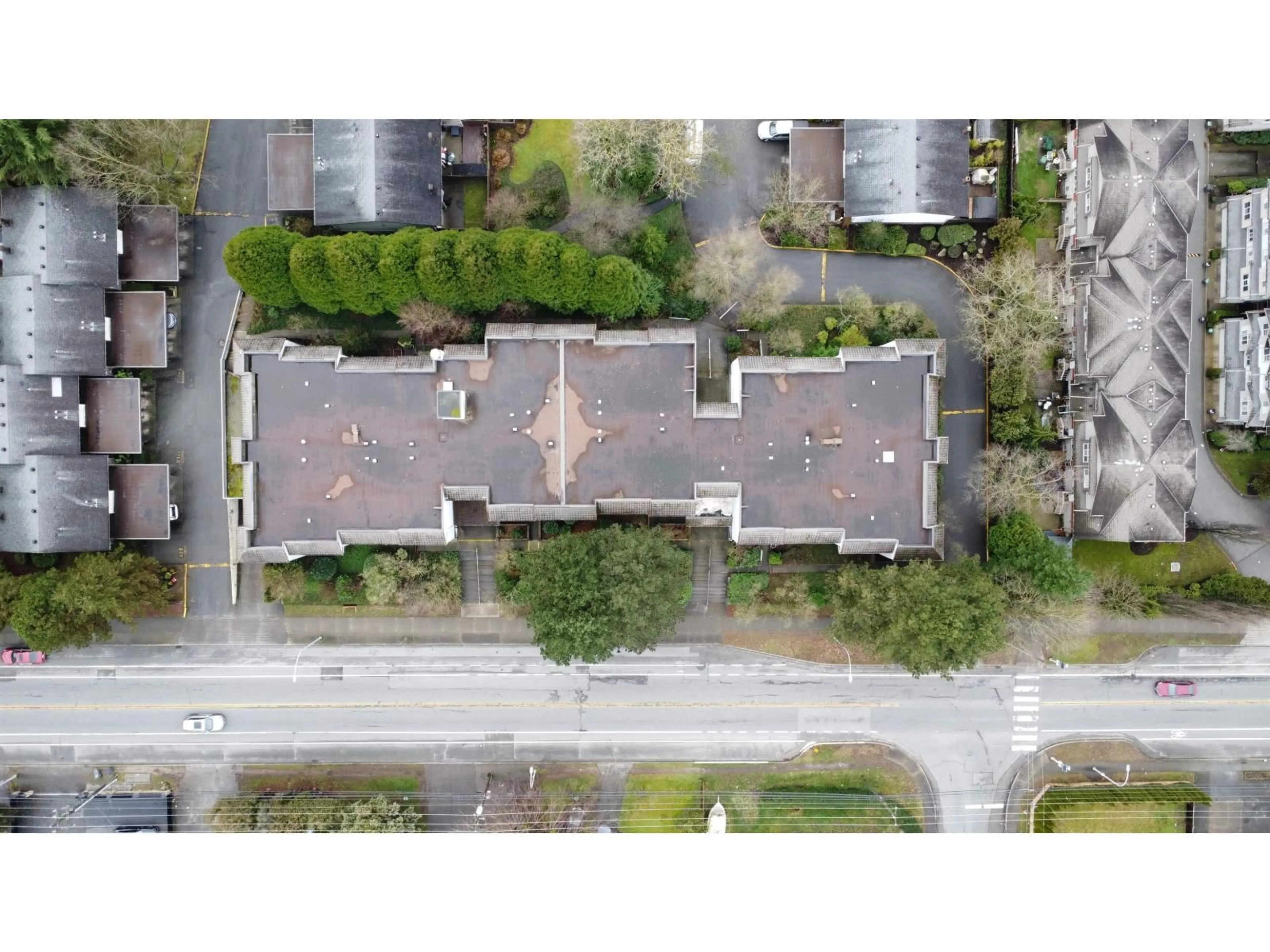 A pic from outside/outdoor area/front of a property/back of a property/a pic from drone, street for 202 - 7473 140 STREET, Surrey British Columbia V3W6G5