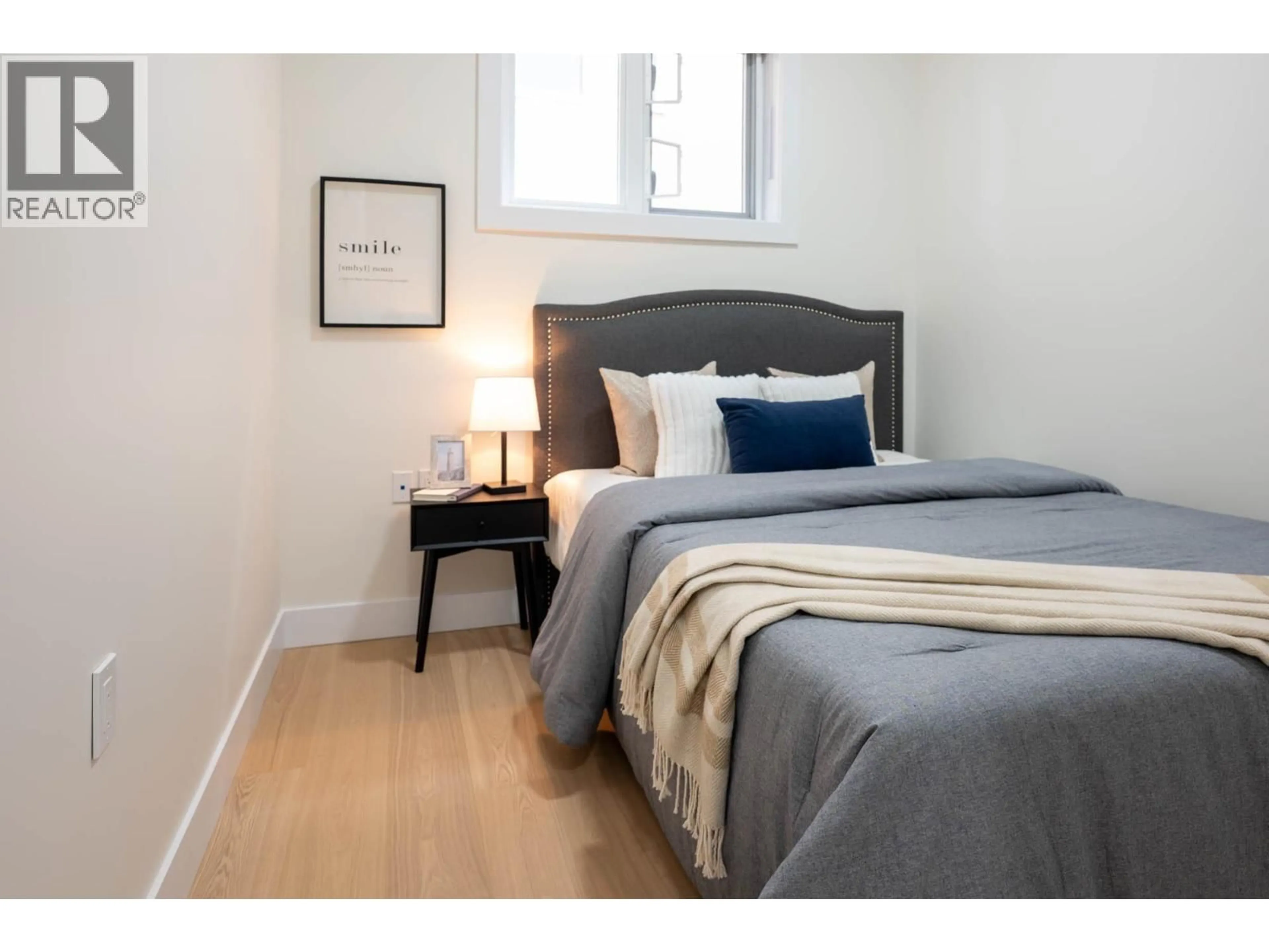 Bedroom with bed, wood/laminate floor for 4874-B LANARK STREET, Vancouver British Columbia V5N3S2