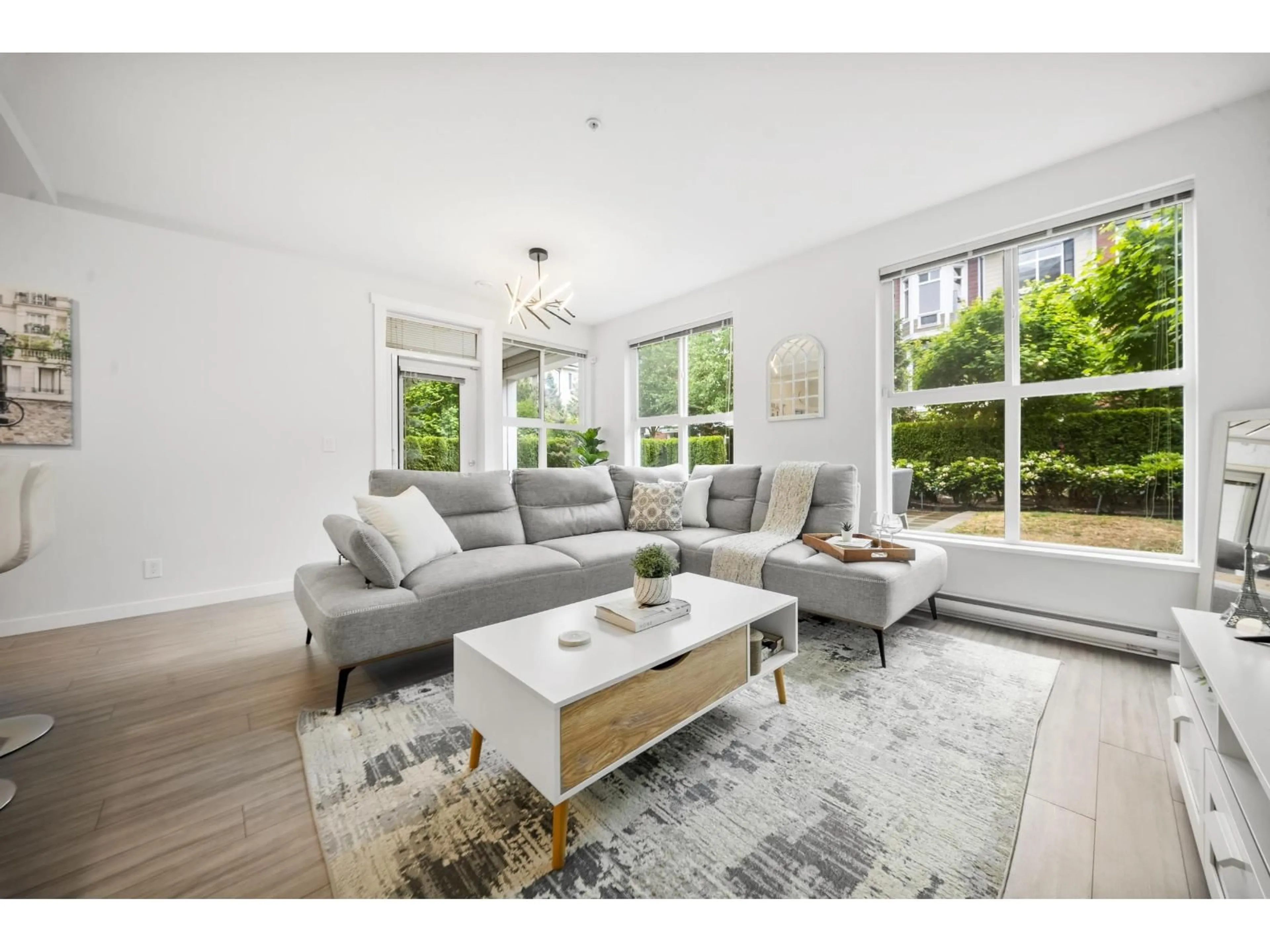 Living room with furniture, wood/laminate floor for D107 - 8150 207 STREET, Langley British Columbia V2Y4J5