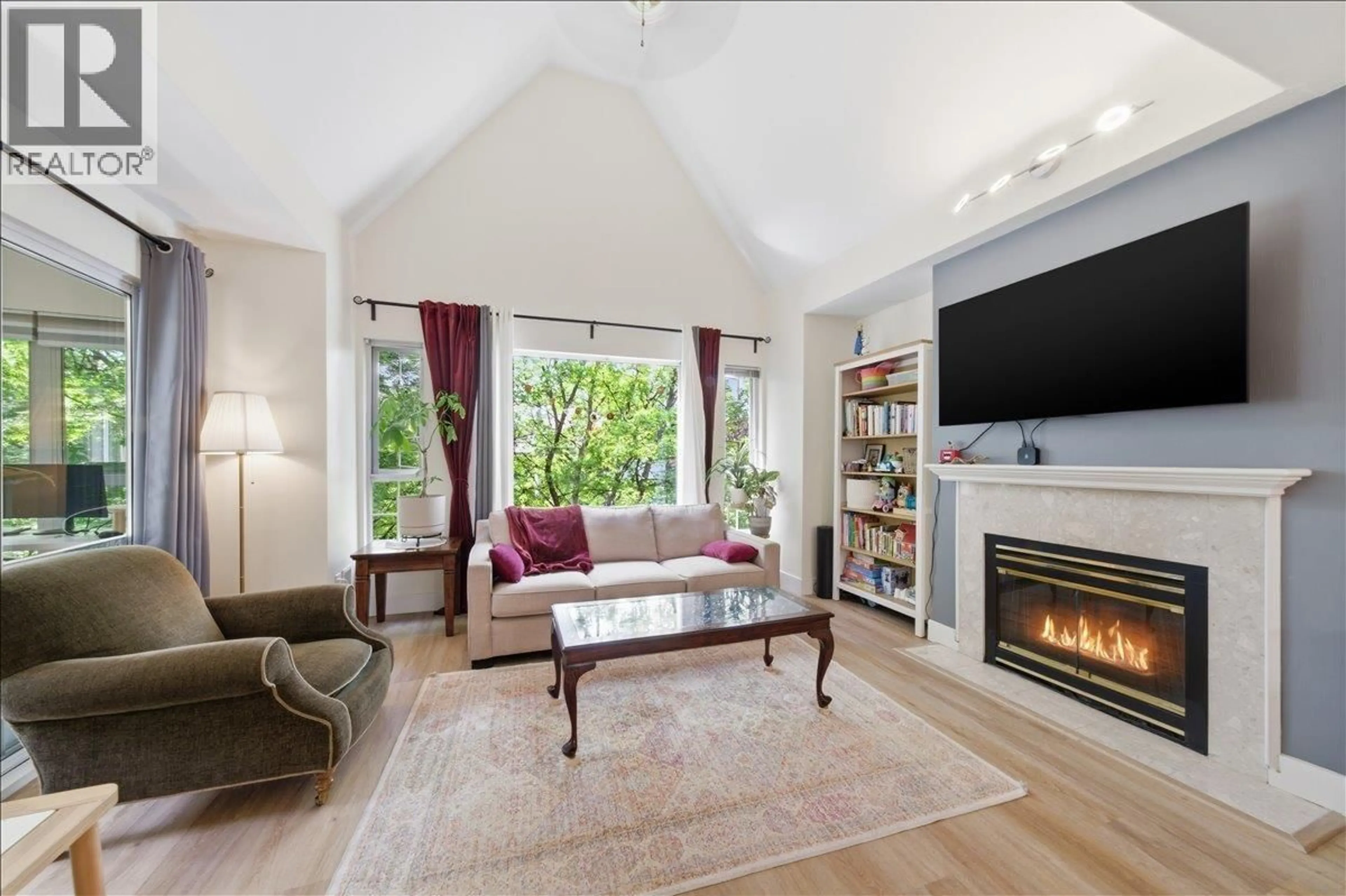 Living room with furniture, wood/laminate floor for 309 - 1550 FELL AVENUE, North Vancouver British Columbia V7P3E7