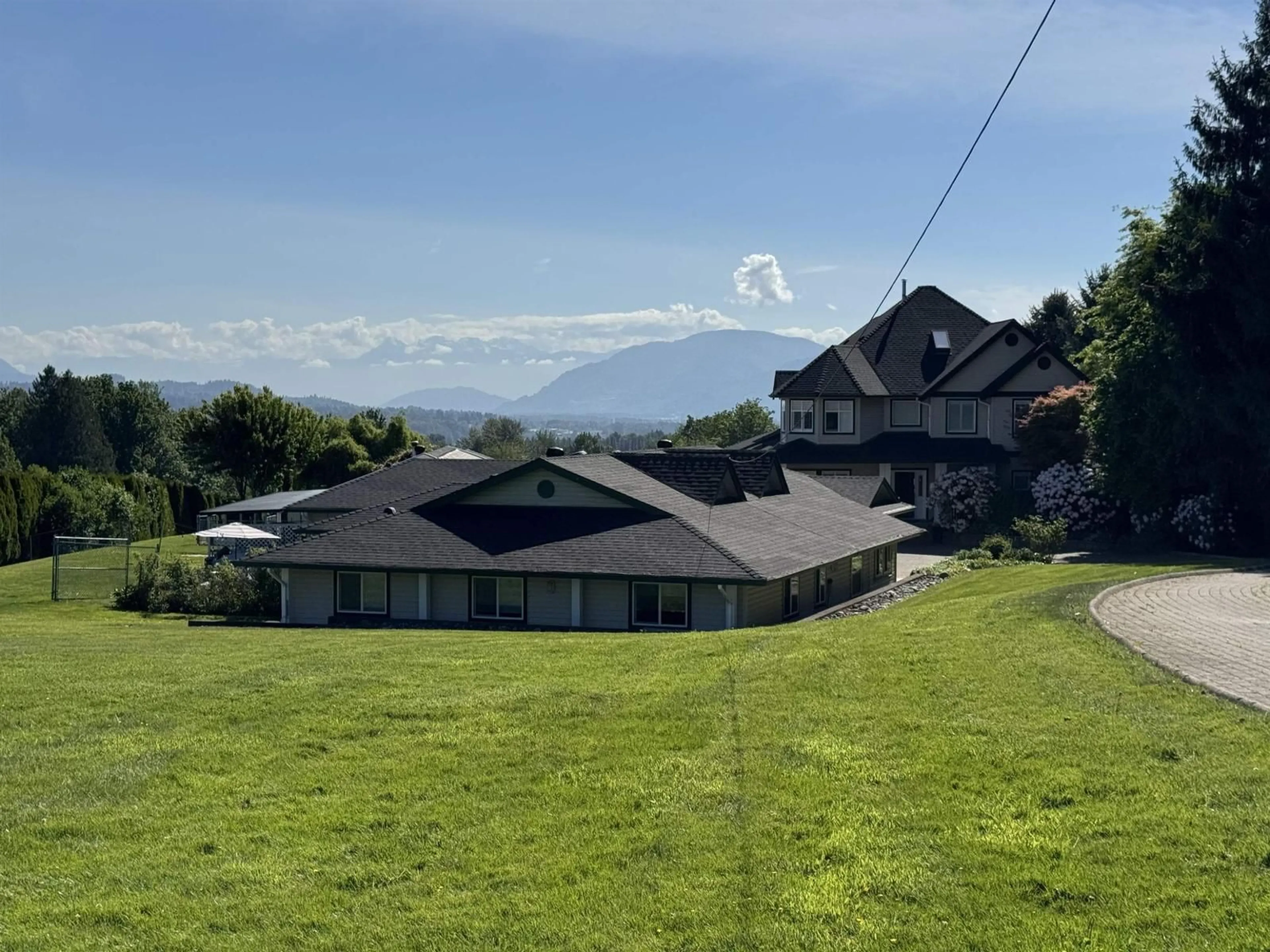 A pic from outside/outdoor area/front of a property/back of a property/a pic from drone, mountain view for 7064 SATCHELL STREET, Abbotsford British Columbia V4X2E3