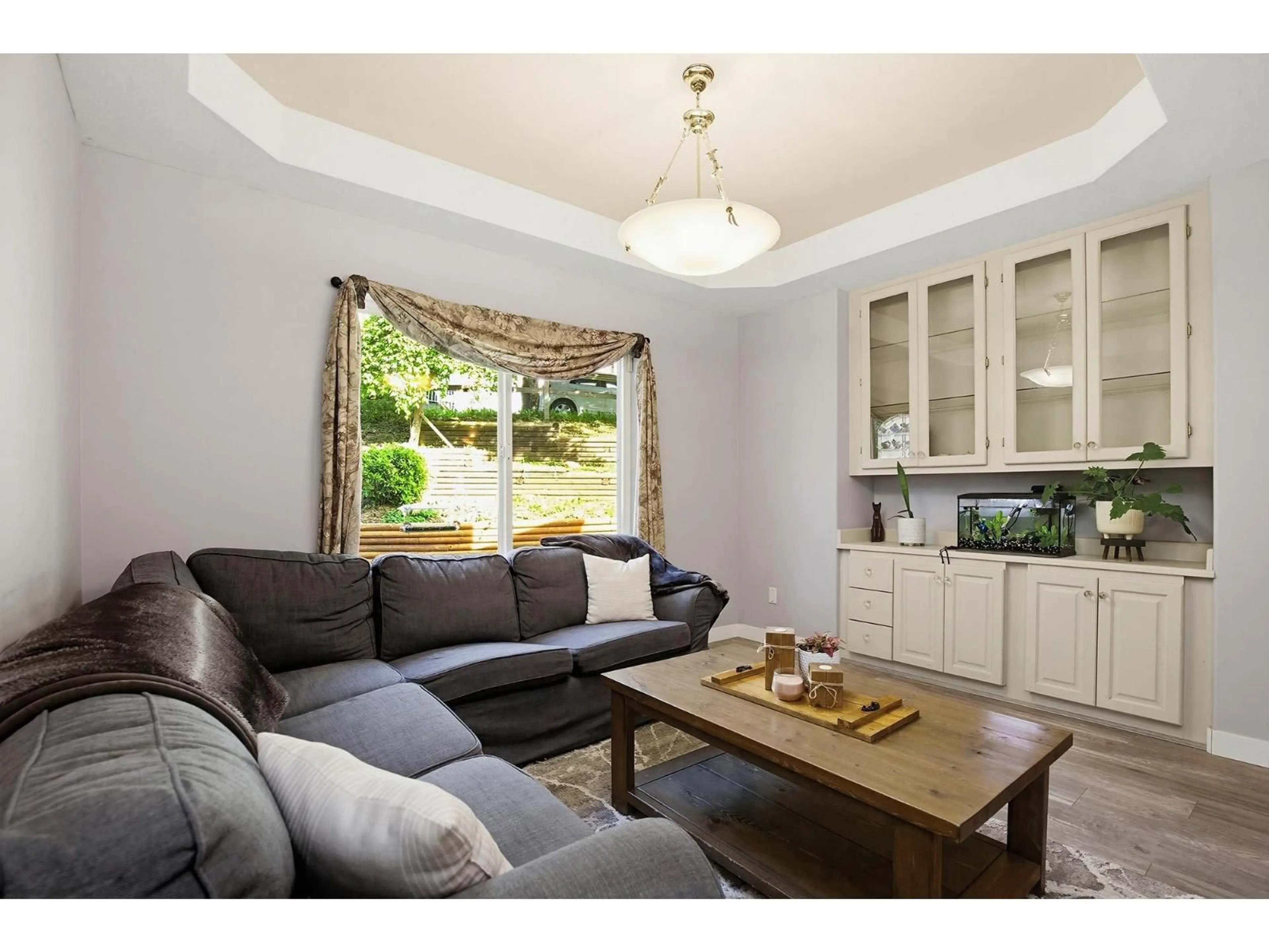 Living room with furniture, wood/laminate floor for 7800 DEERFIELD STREET, Mission British Columbia V2V5X3