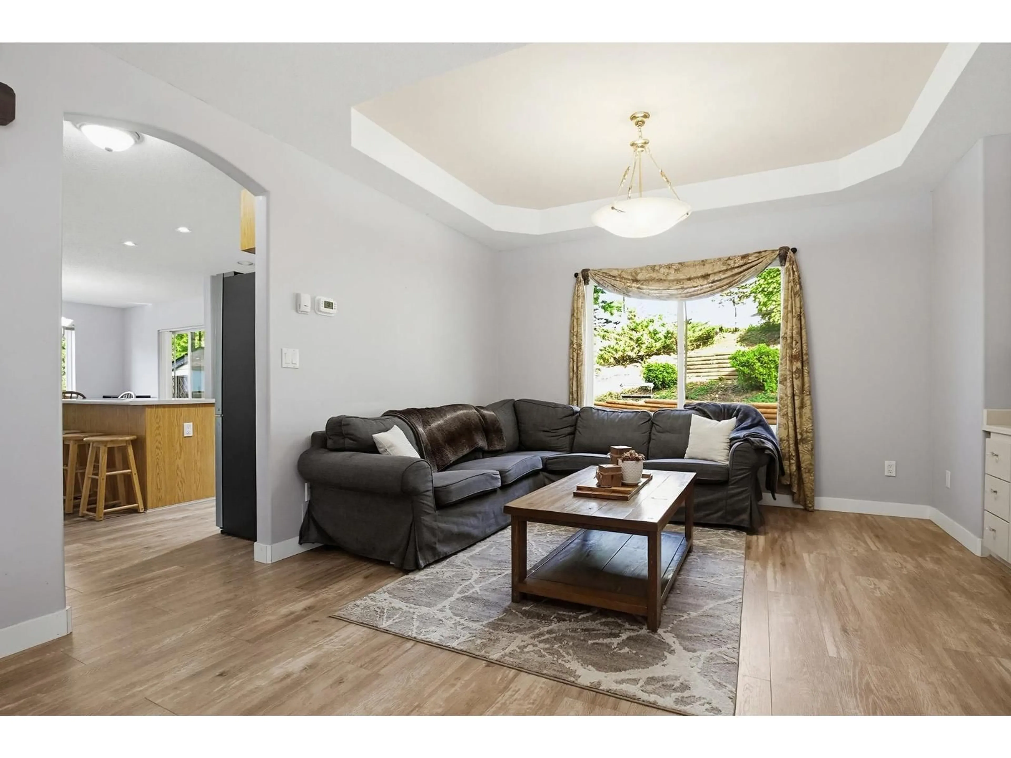 Living room with furniture, wood/laminate floor for 7800 DEERFIELD STREET, Mission British Columbia V2V5X3