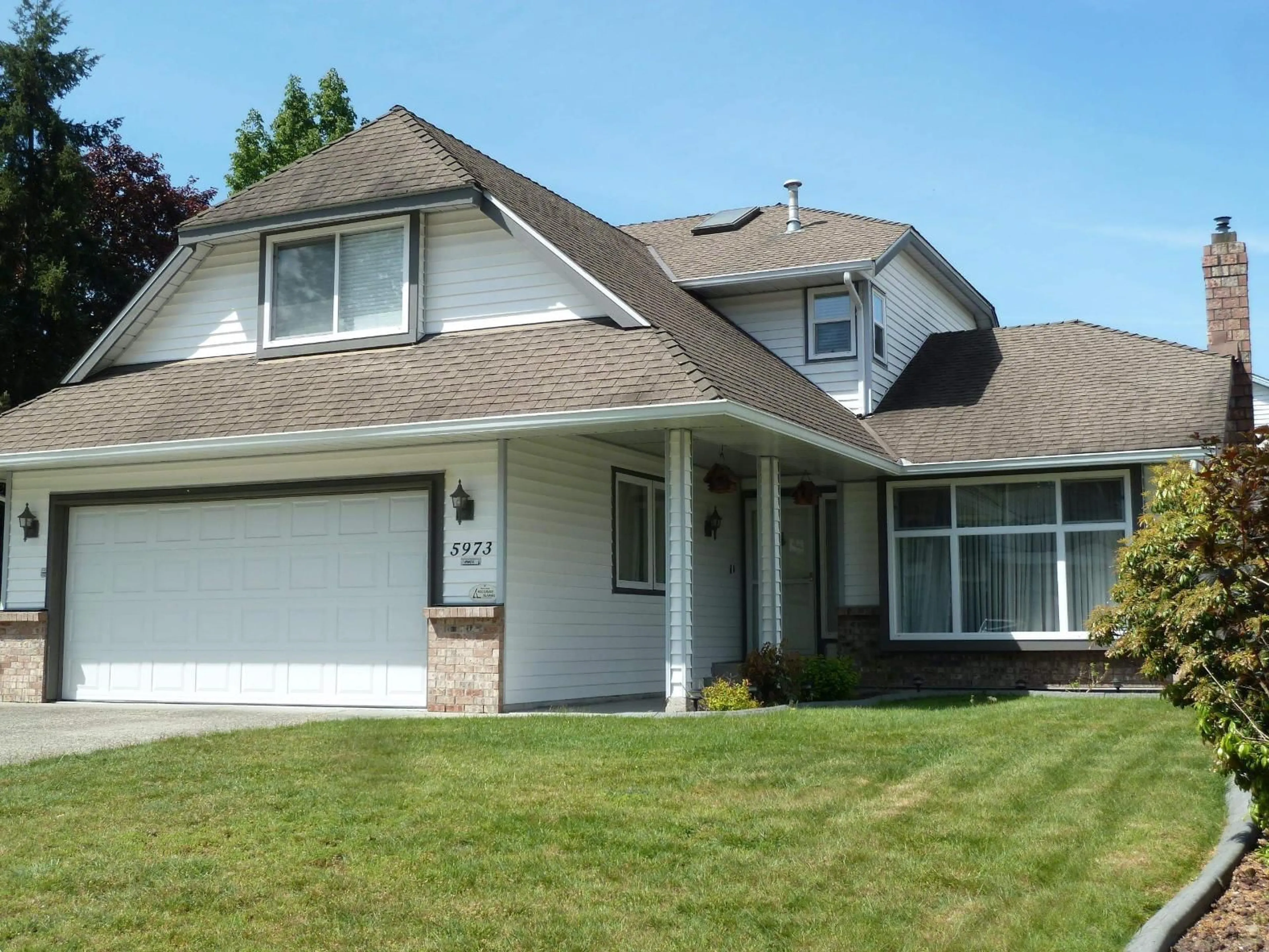 Home with vinyl exterior material, street for 5973 135 STREET, Surrey British Columbia V3X1L2