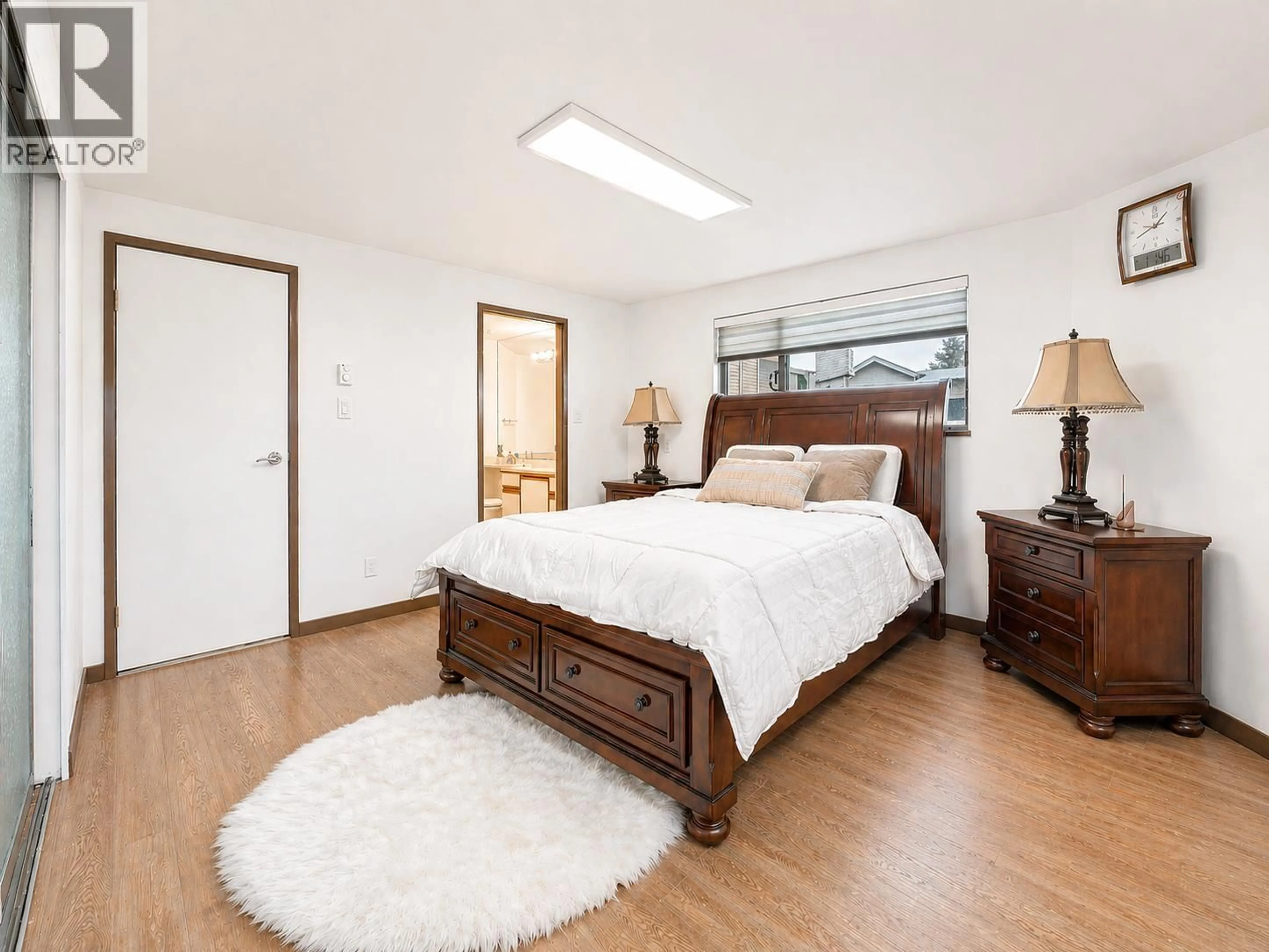 Bedroom with bed, wood/laminate floor for 14 - 3459 RIVER ROAD, Delta British Columbia V4K4Y6