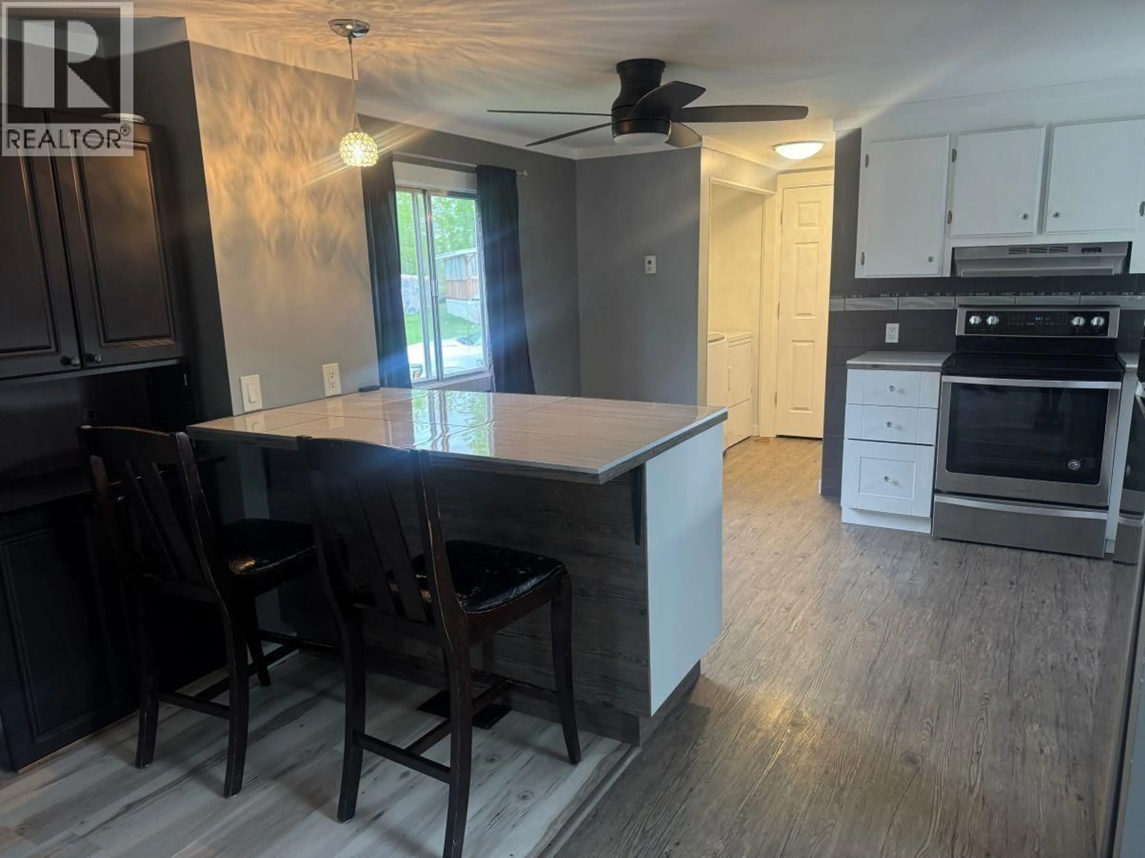 Open concept kitchen, wood/laminate floor for 30 - 6100 DAKELH, Prince George British Columbia V2N4R1