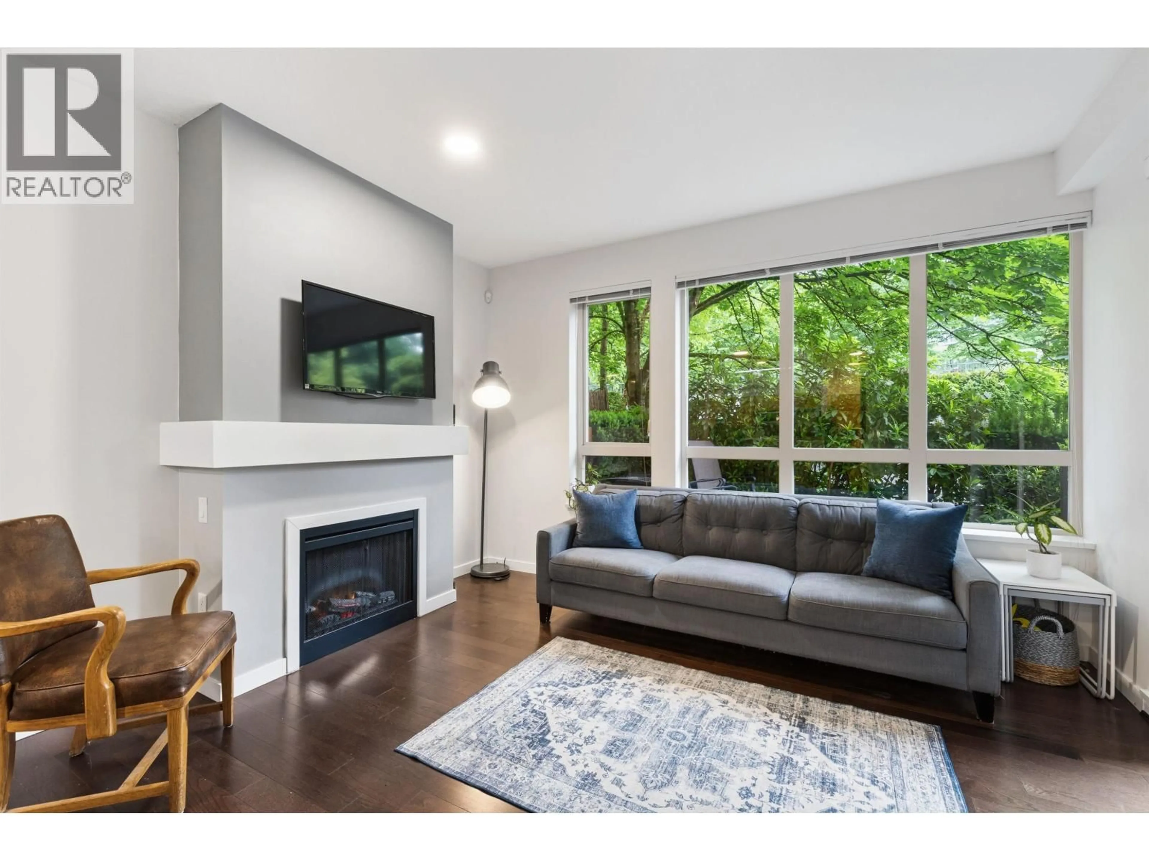 Living room with furniture, wood/laminate floor for 123 - 801 KLAHANIE DRIVE, Port Moody British Columbia V3H5K4
