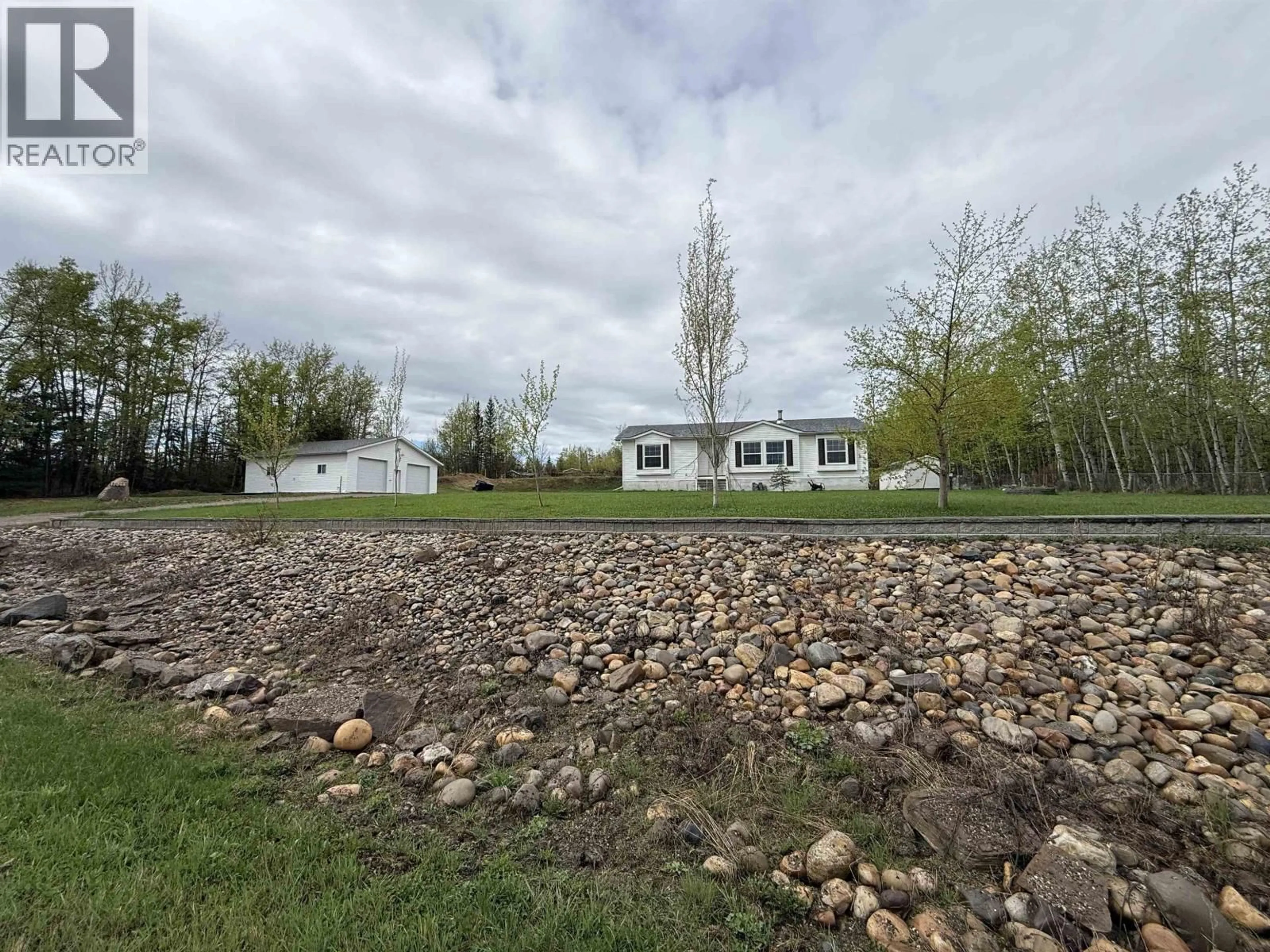 A pic from outside/outdoor area/front of a property/back of a property/a pic from drone, unknown for 13048 HUNTERS LANE, Fort St. John British Columbia V0C1H0