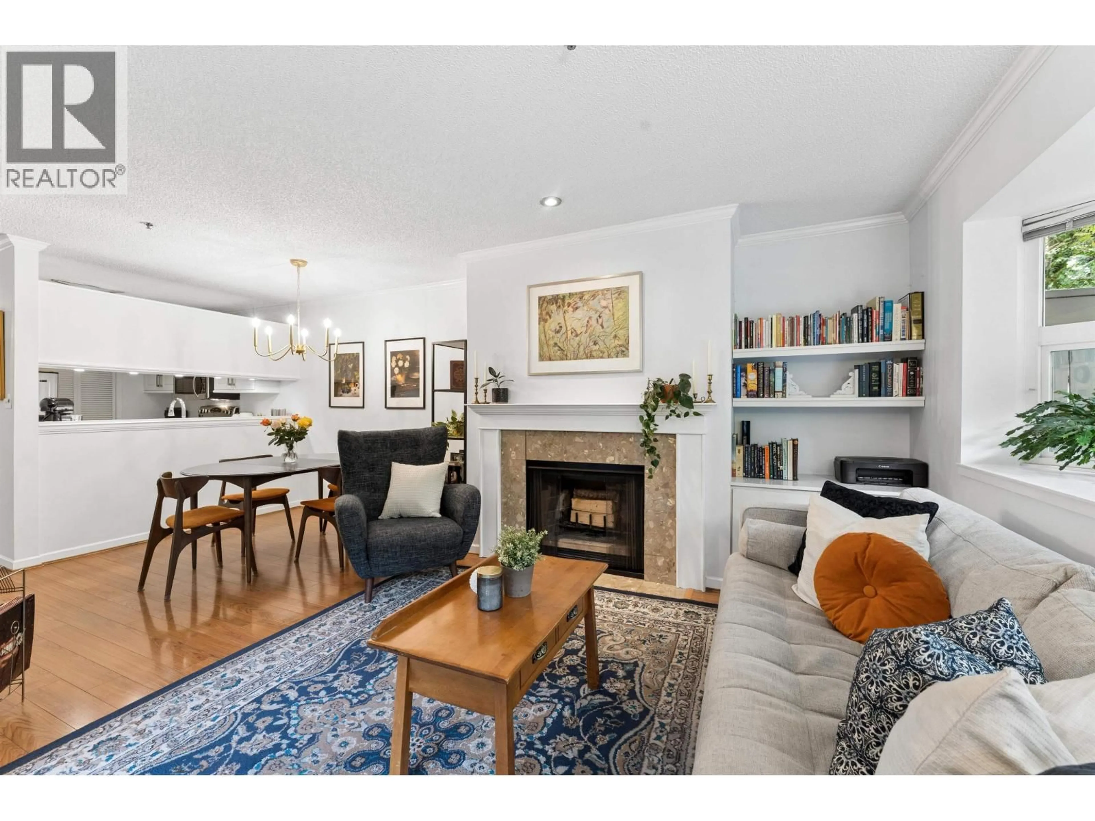 Living room with furniture, wood/laminate floor for 105 - 2256 7TH AVENUE, Vancouver British Columbia V6K1Y2