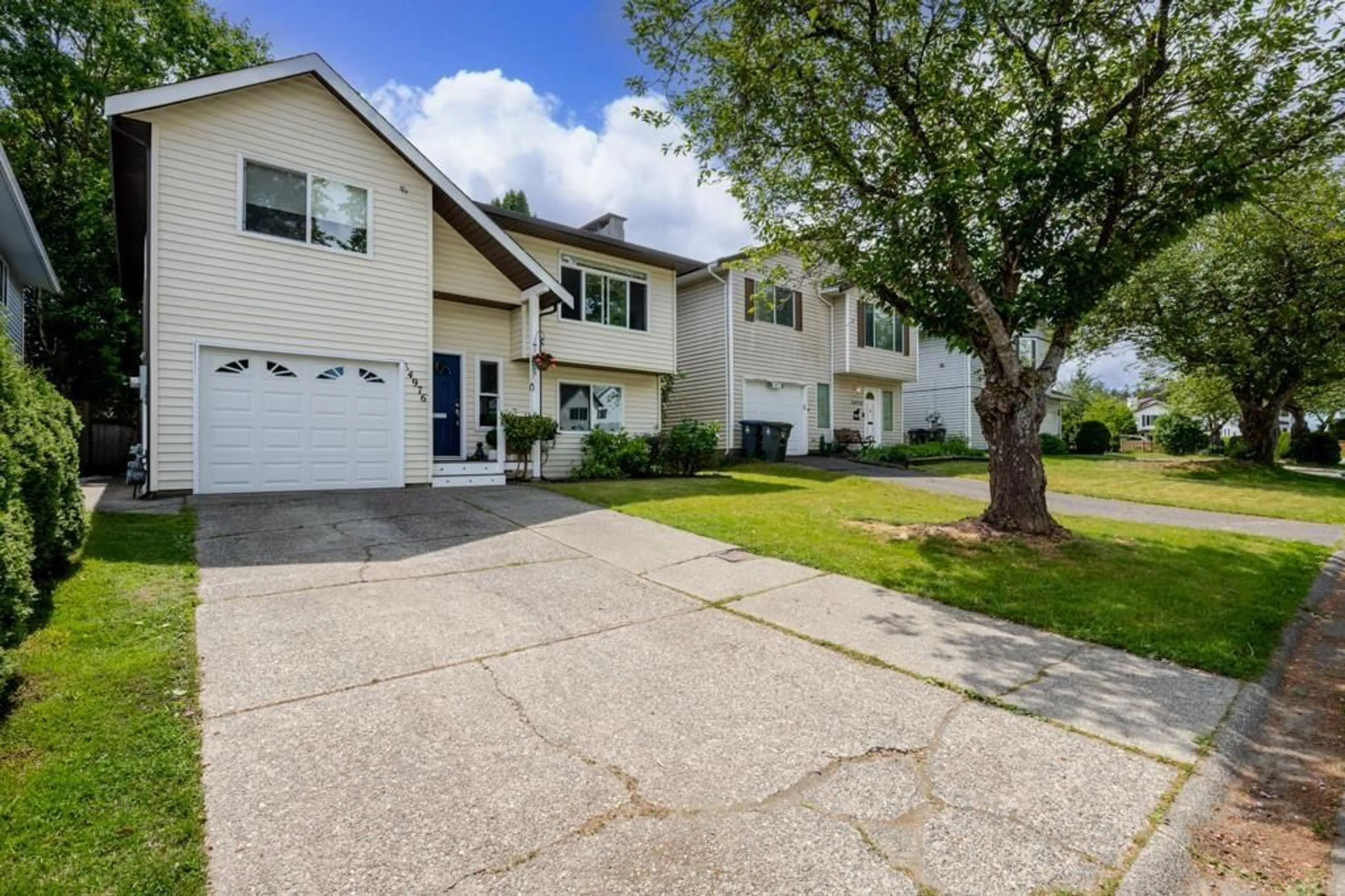 Home with vinyl exterior material, street for 14976 98A AVENUE, Surrey British Columbia V3R8G9