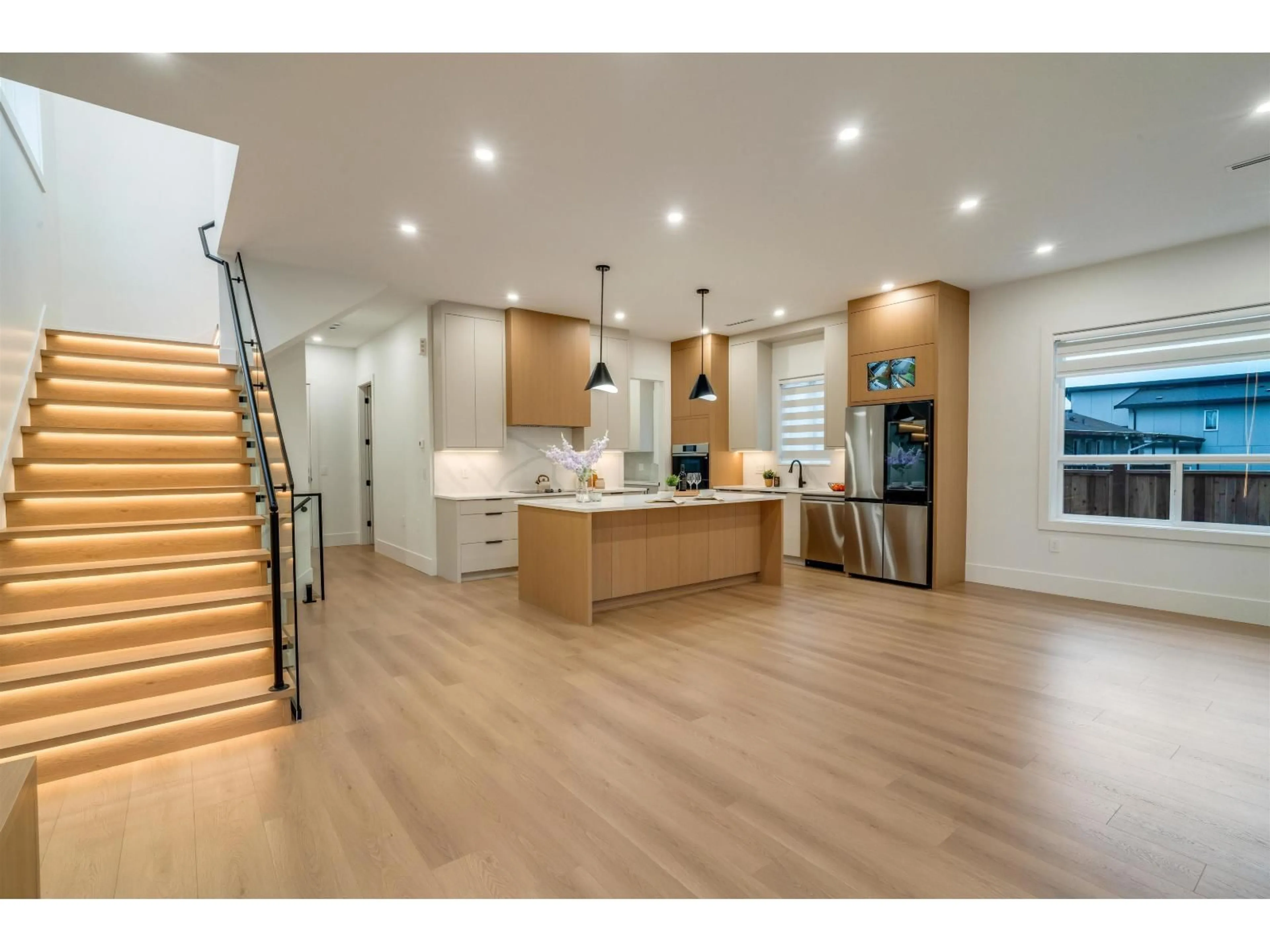Open concept kitchen, wood/laminate floor for 11772 92 AVENUE, Delta British Columbia V4C3L4