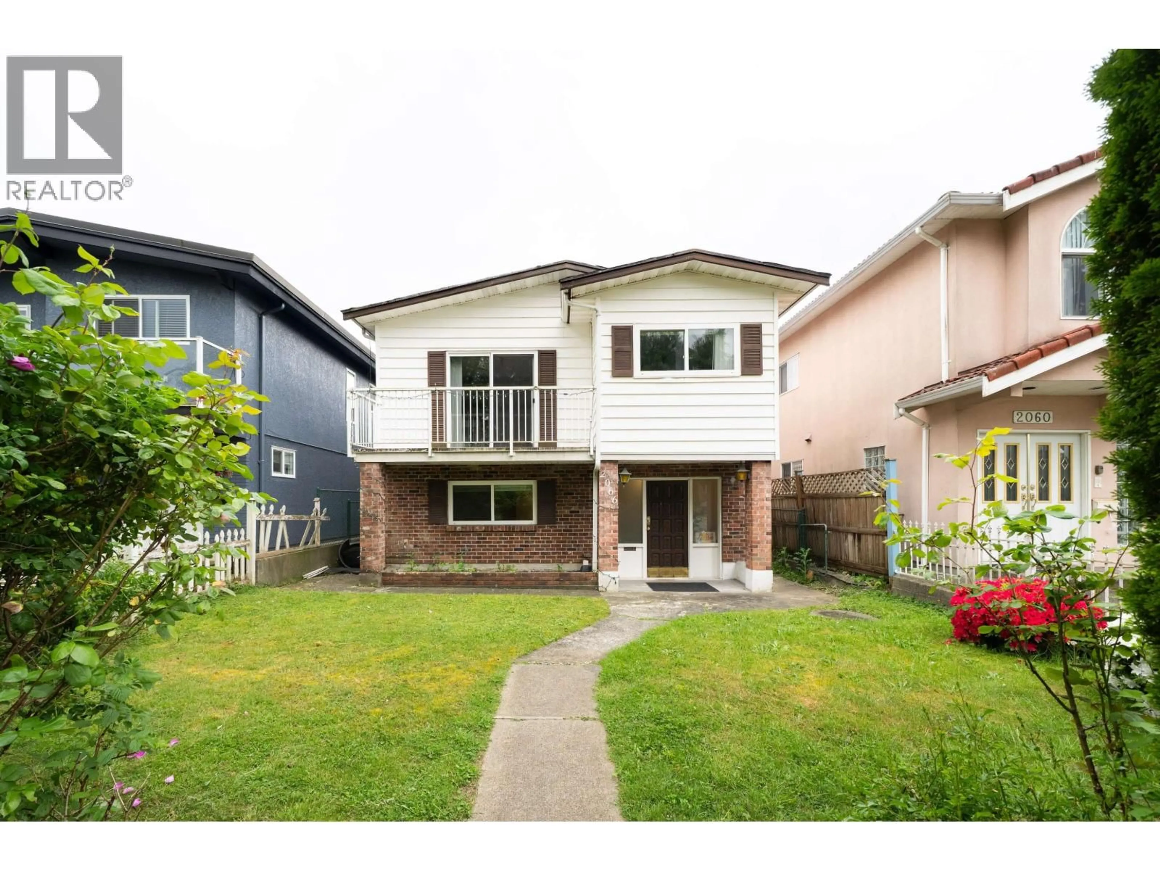 Home with vinyl exterior material, street for 2066 23RD AVENUE, Vancouver British Columbia V5N2V1