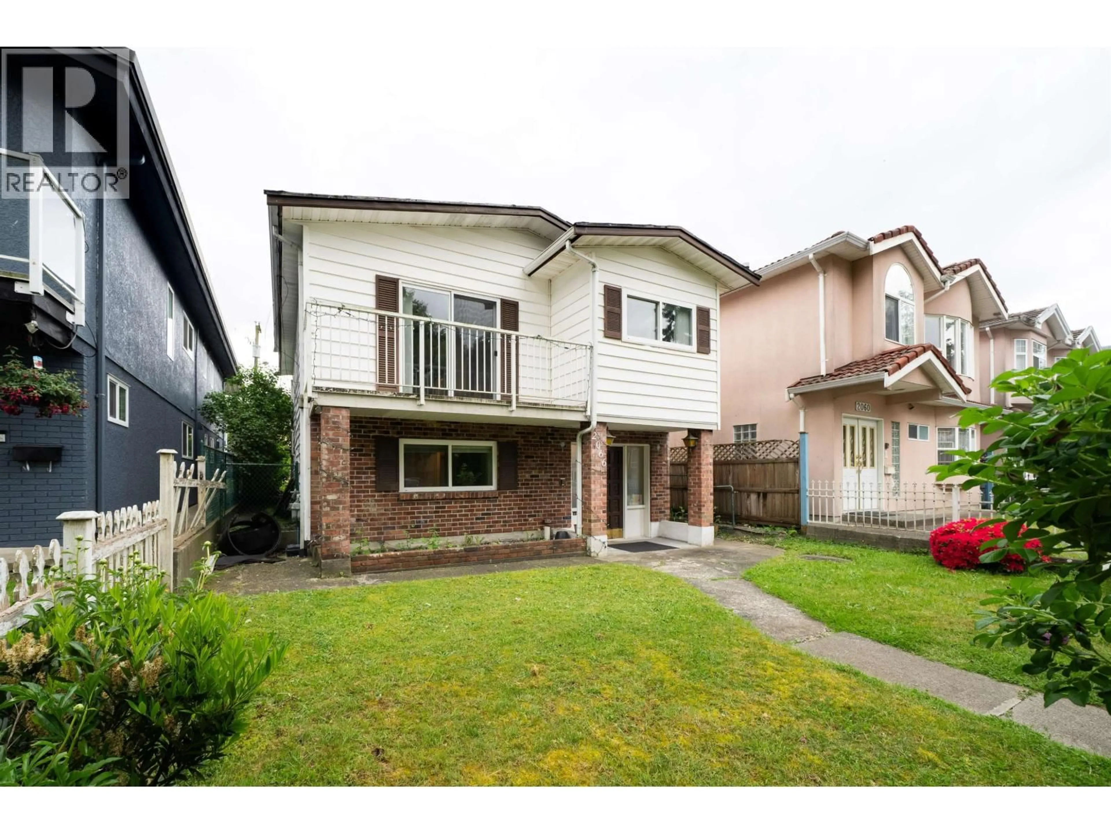 Home with vinyl exterior material, street for 2066 23RD AVENUE, Vancouver British Columbia V5N2V1