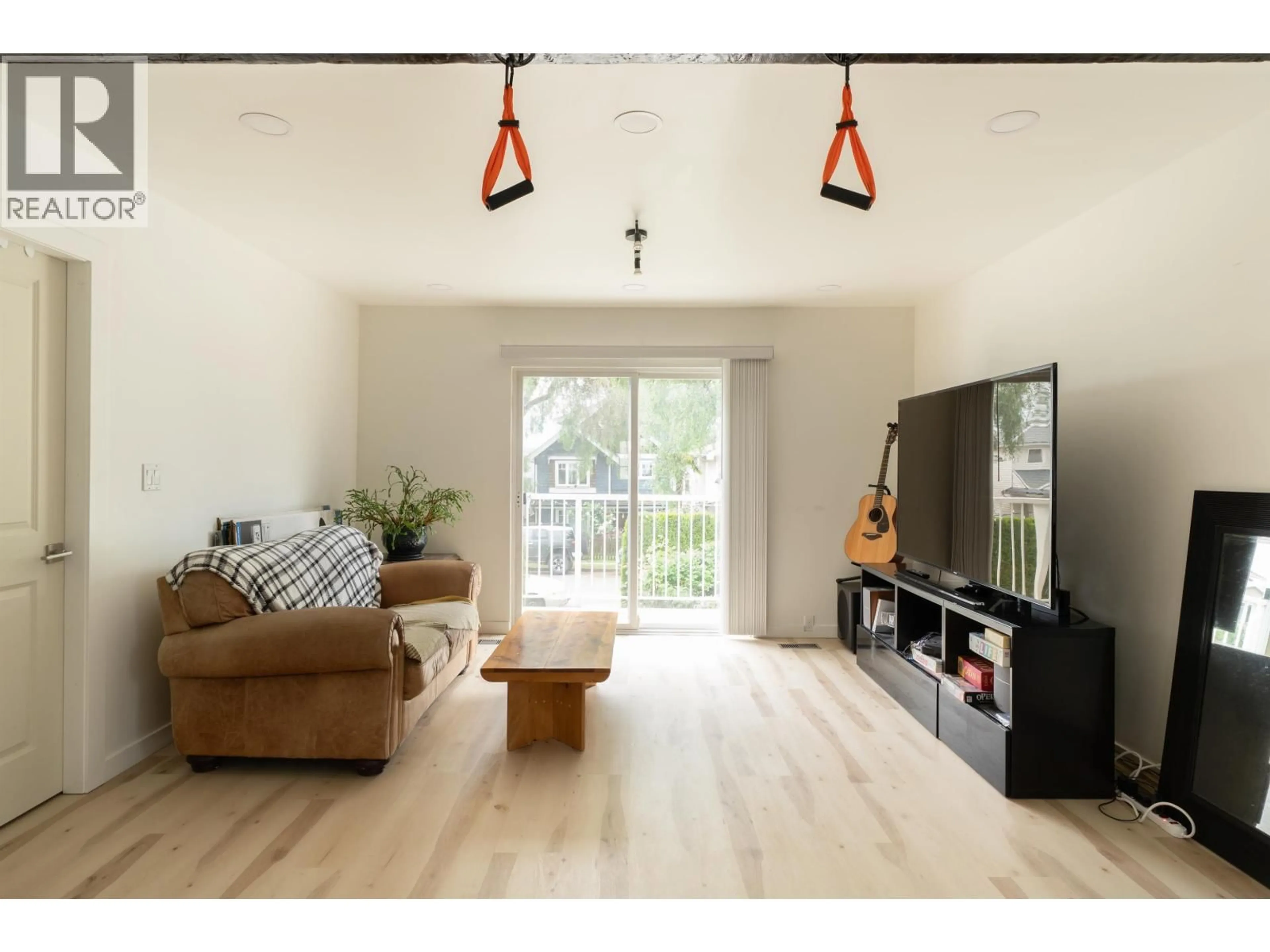 Living room with furniture, wood/laminate floor for 2066 23RD AVENUE, Vancouver British Columbia V5N2V1