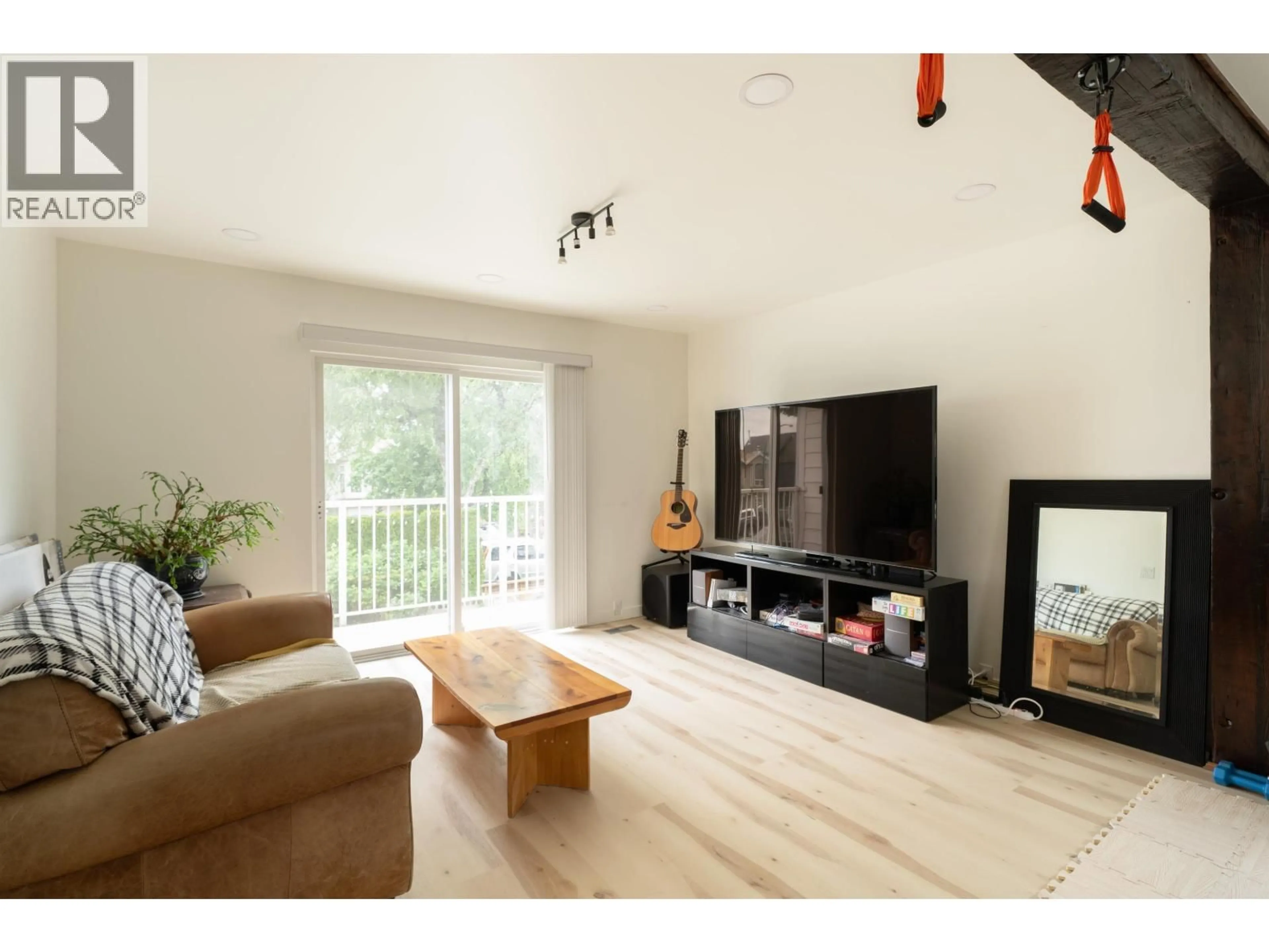 Living room with furniture, wood/laminate floor for 2066 23RD AVENUE, Vancouver British Columbia V5N2V1
