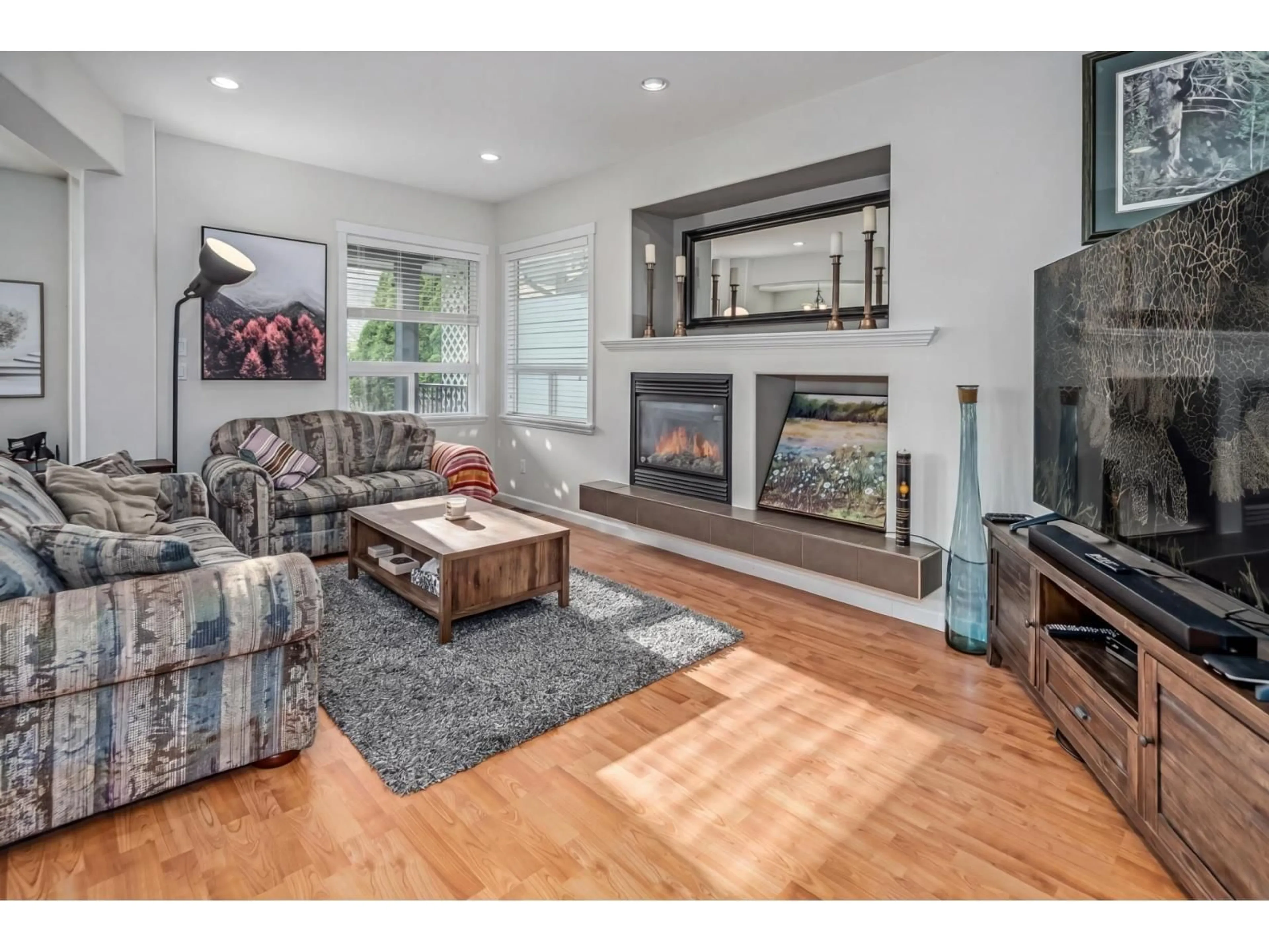 Living room with furniture, wood/laminate floor for 19141 68 AVENUE, Surrey British Columbia V4N5P3