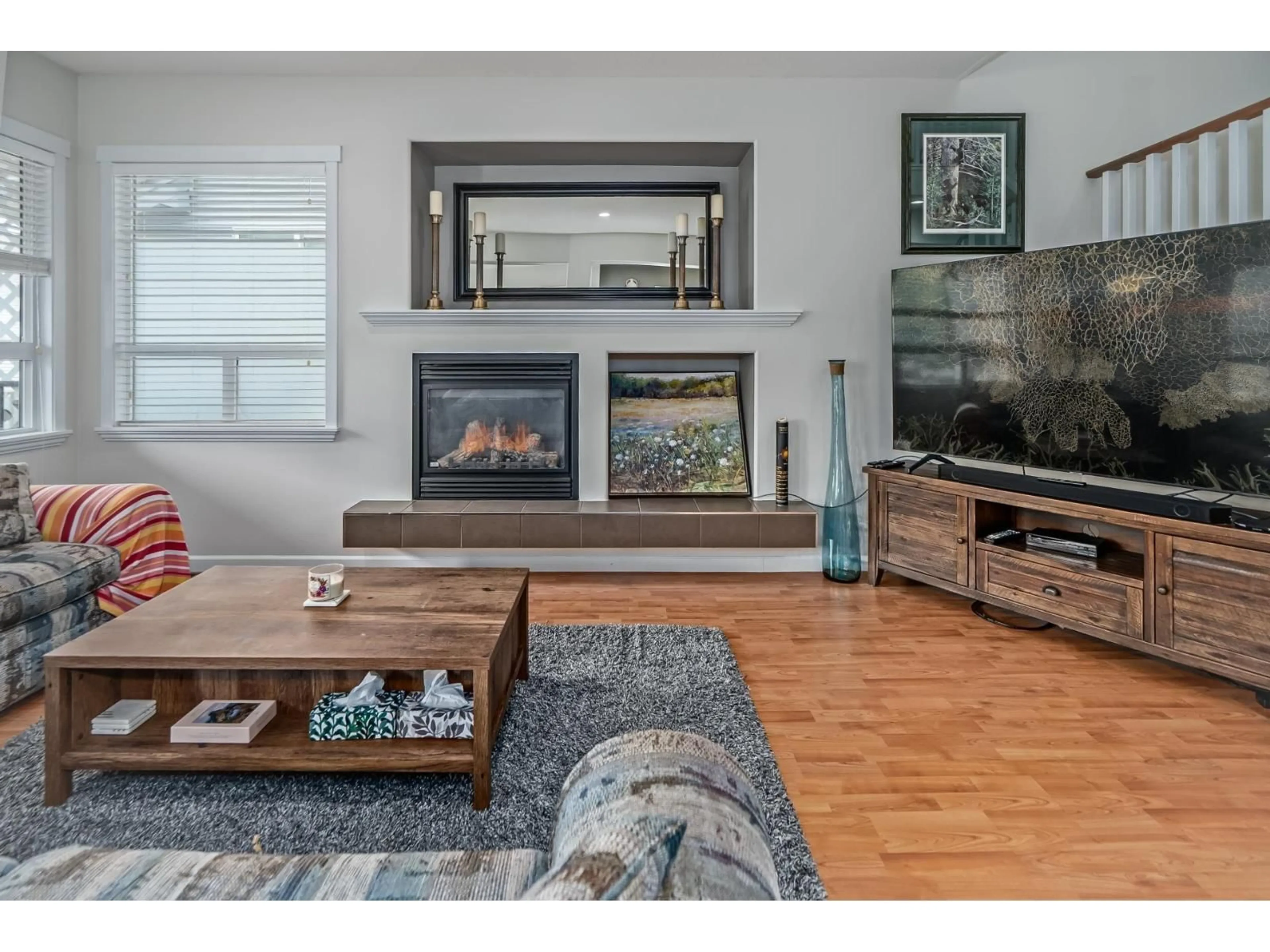 Living room with furniture, wood/laminate floor for 19141 68 AVENUE, Surrey British Columbia V4N5P3