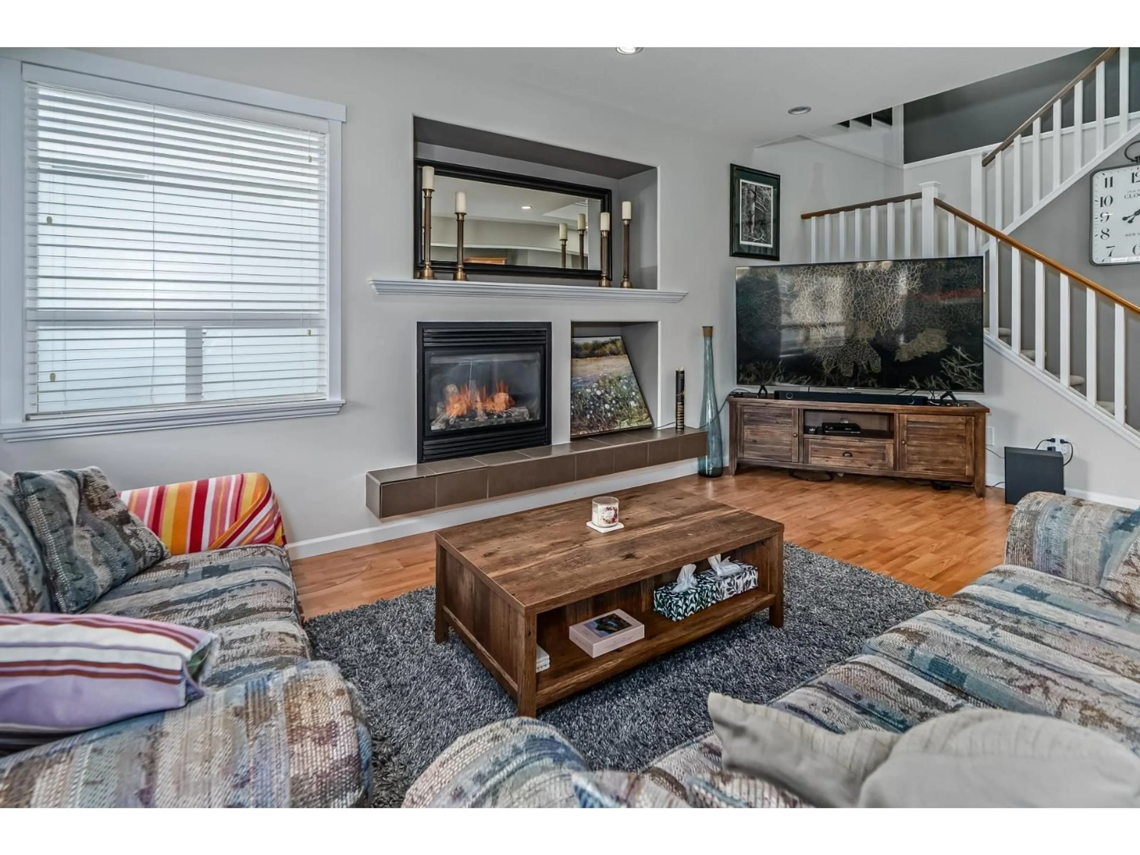 Living room with furniture, wood/laminate floor for 19141 68 AVENUE, Surrey British Columbia V4N5P3