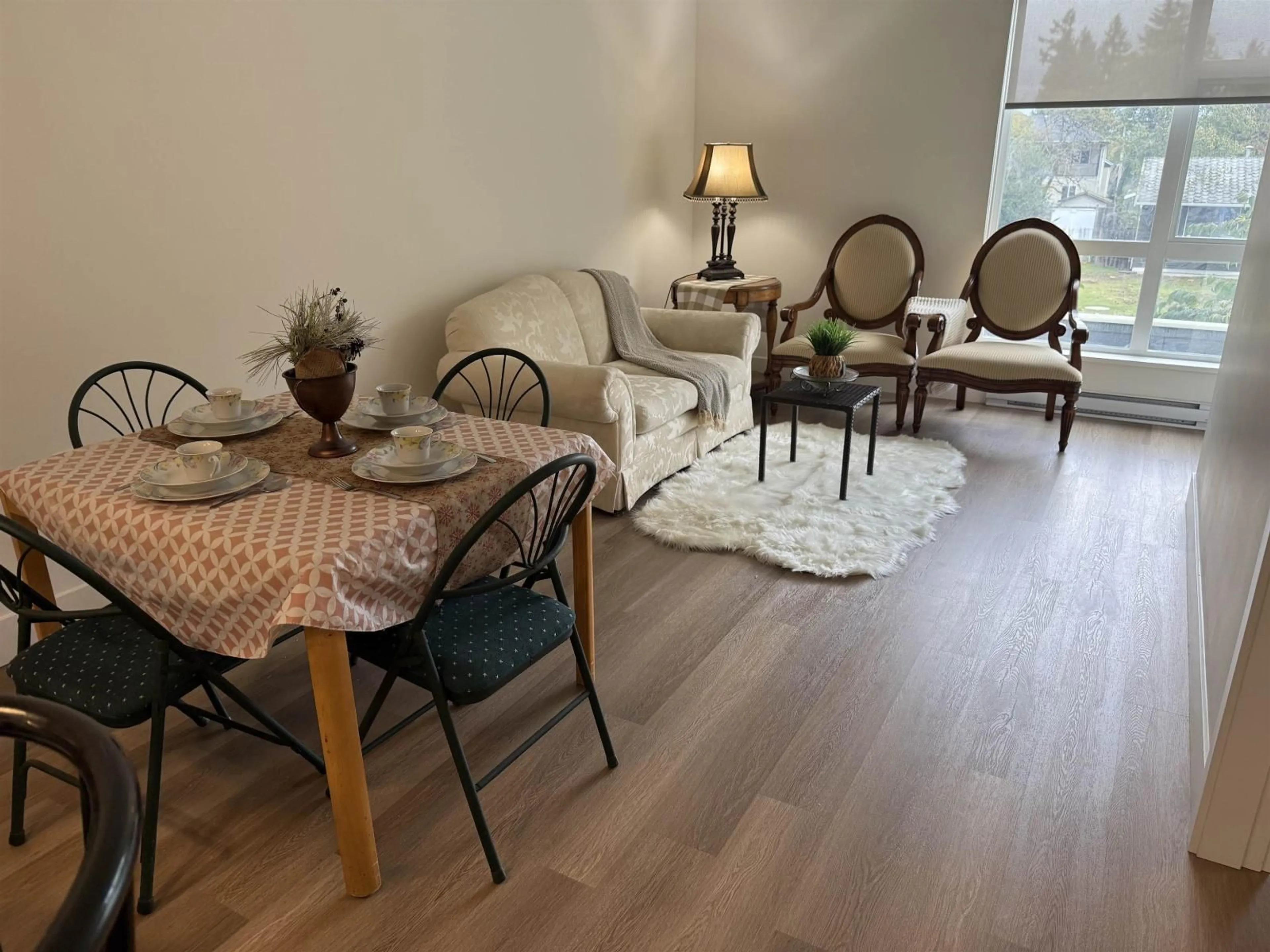 Living room with furniture, wood/laminate floor for 210 - 10778 138 STREET, Surrey British Columbia V3T0S5