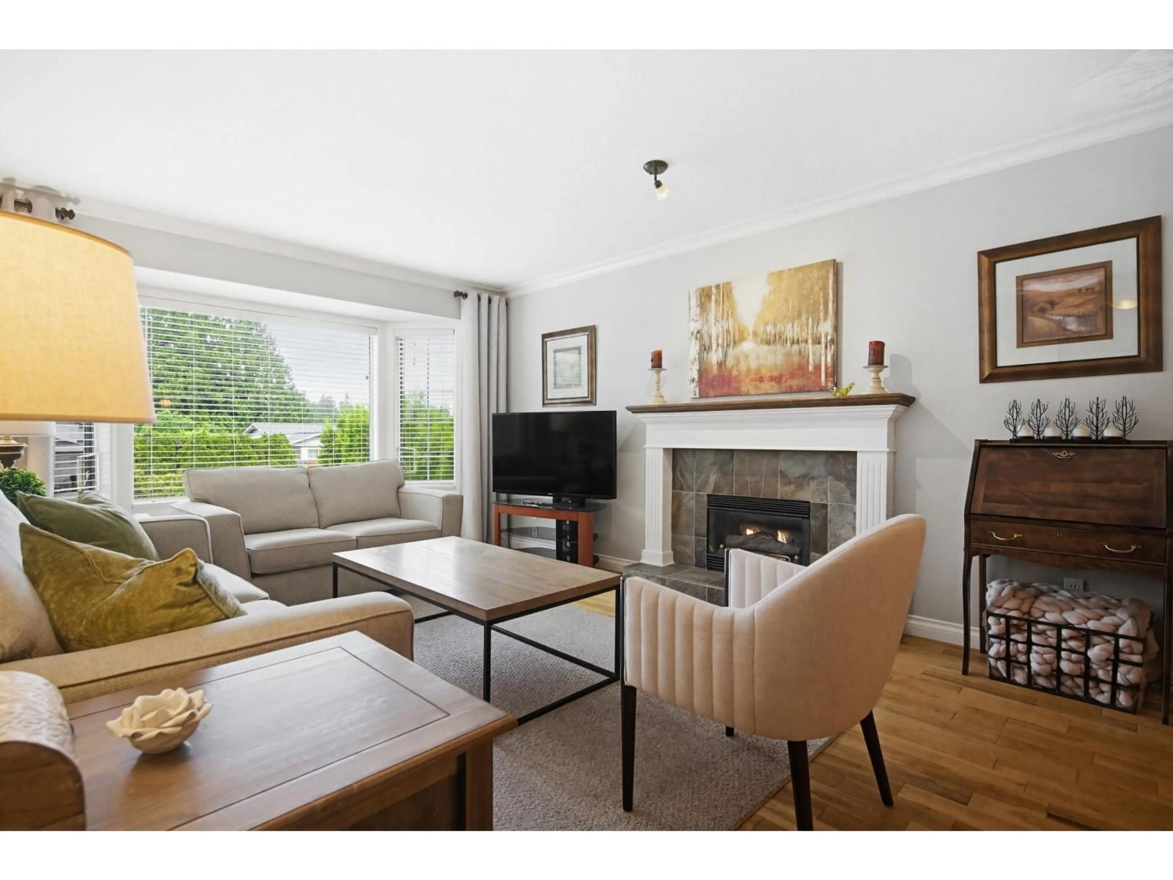Living room with furniture, wood/laminate floor for 20474 43A AVENUE, Langley British Columbia V3A3C8