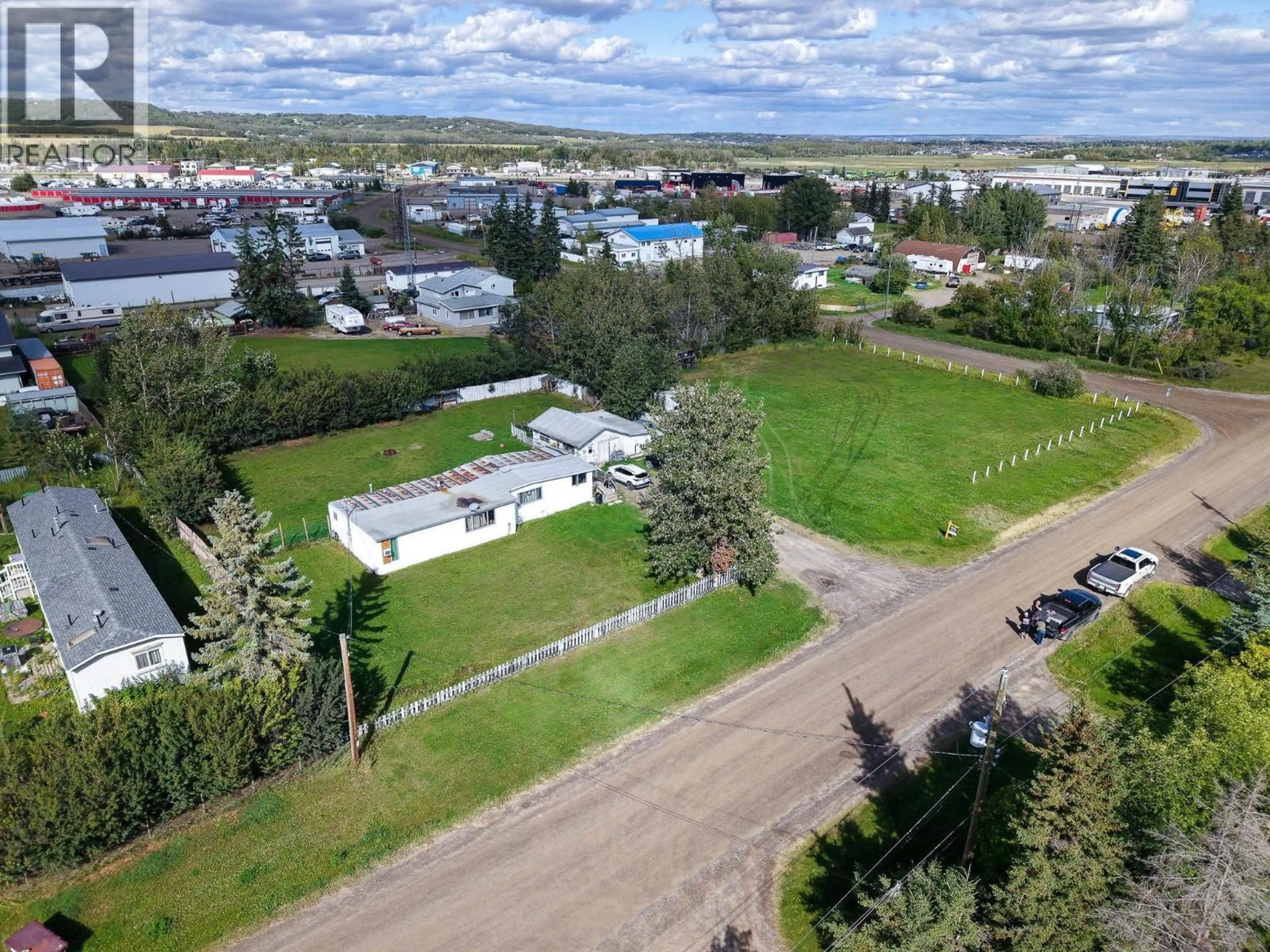 A pic from outside/outdoor area/front of a property/back of a property/a pic from drone, unknown for 12282 COTTONWOOD AVENUE, Fort St. John British Columbia V1J8B1