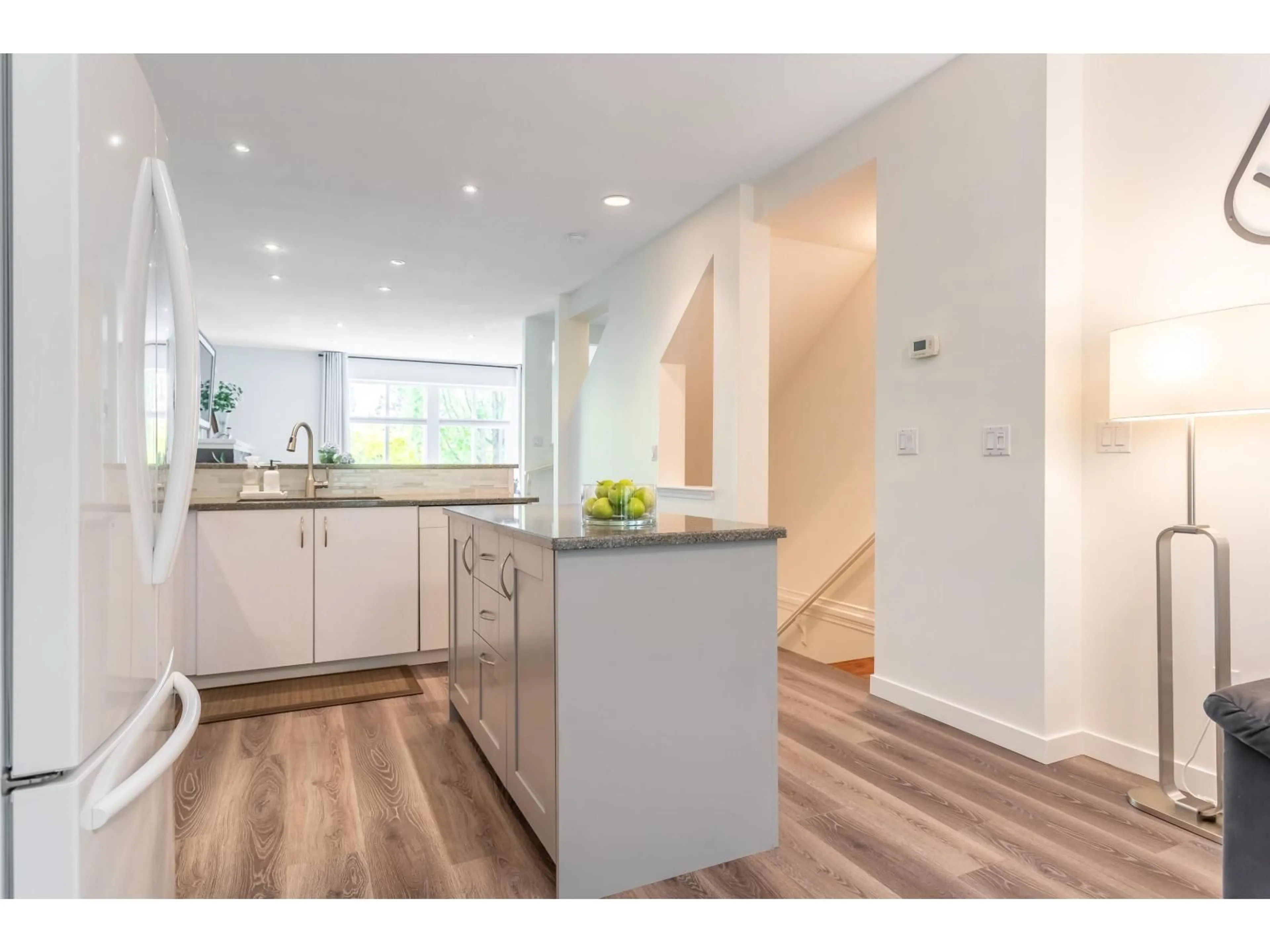 Open concept kitchen, wood/laminate floor for 4 - 14959 58 AVENUE, Surrey British Columbia V3S9Y9