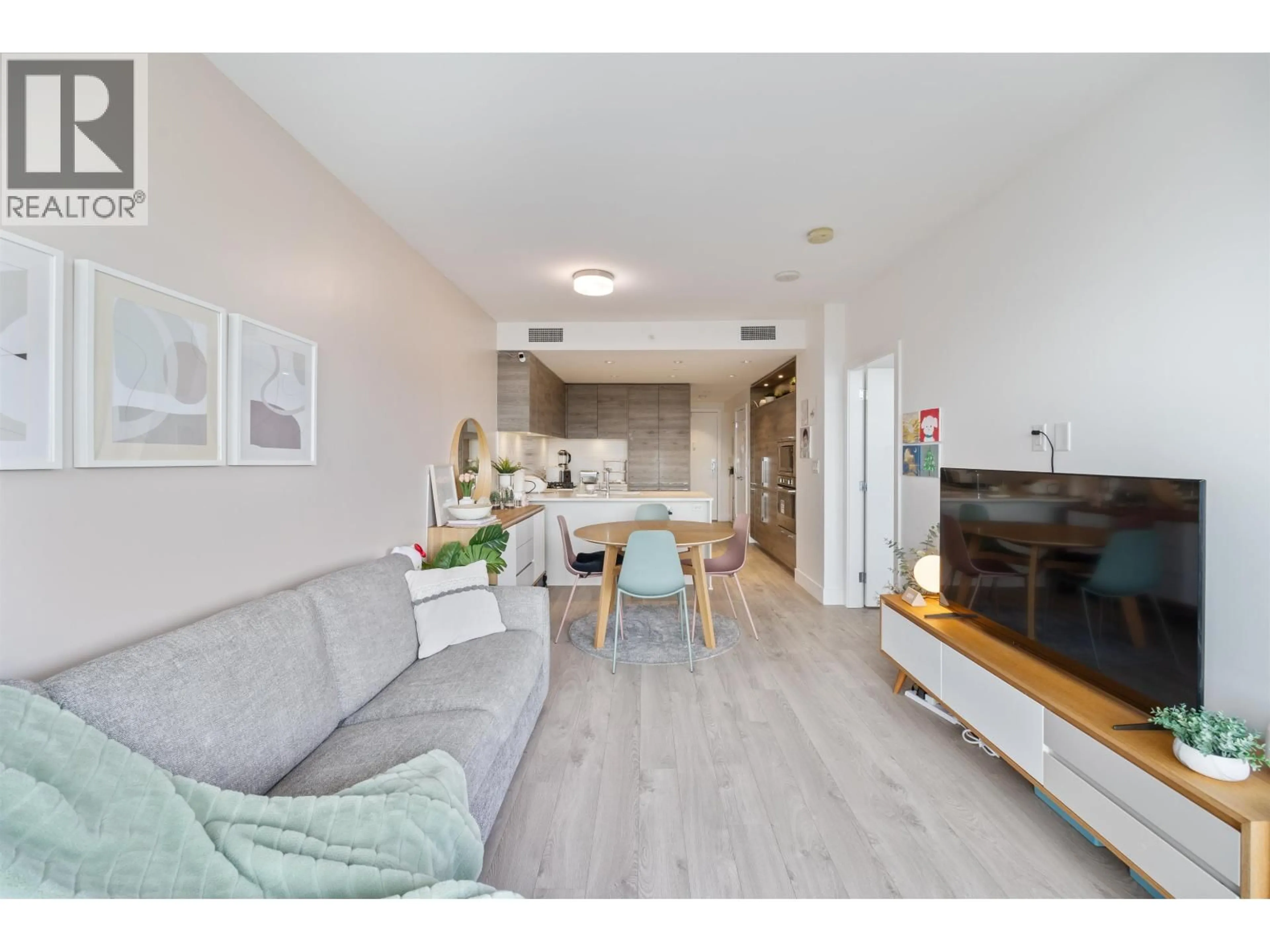 Living room with furniture, wood/laminate floor for 2106 - 7303 NOBLE LANE, Burnaby British Columbia V3N0H2