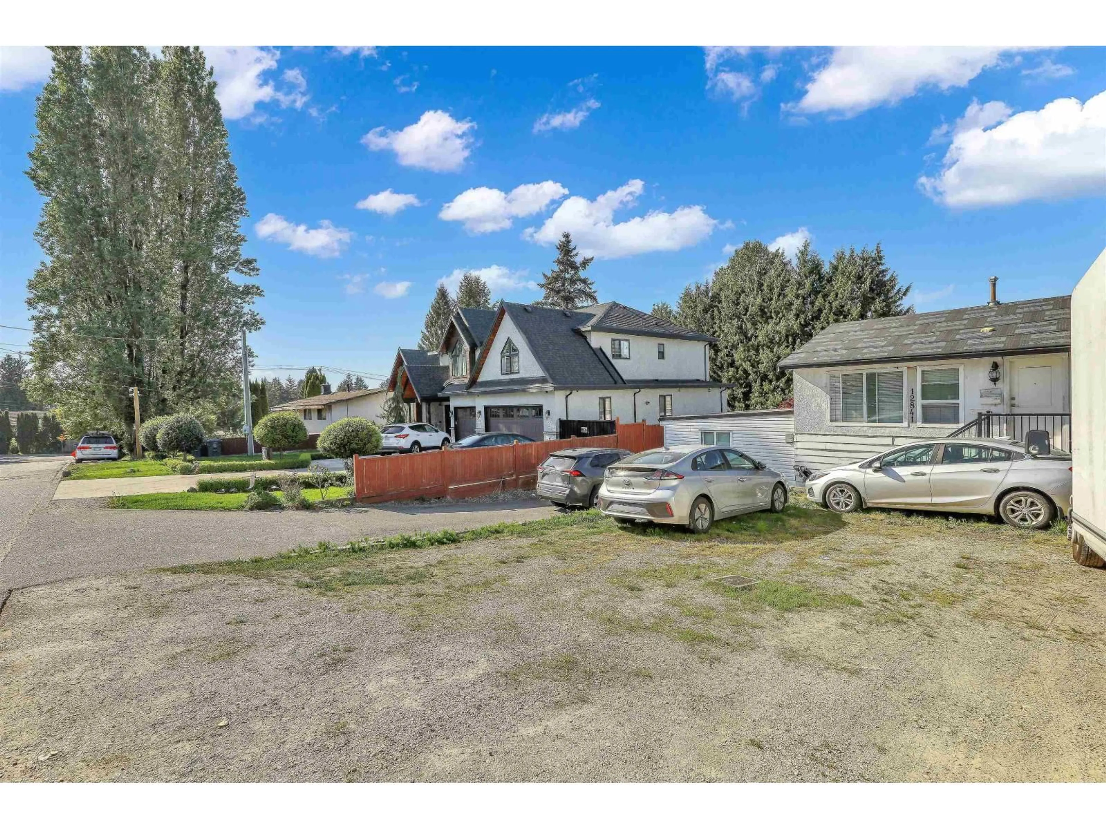 A pic from outside/outdoor area/front of a property/back of a property/a pic from drone, street for 12841 98 AVENUE, Surrey British Columbia V2T5J9