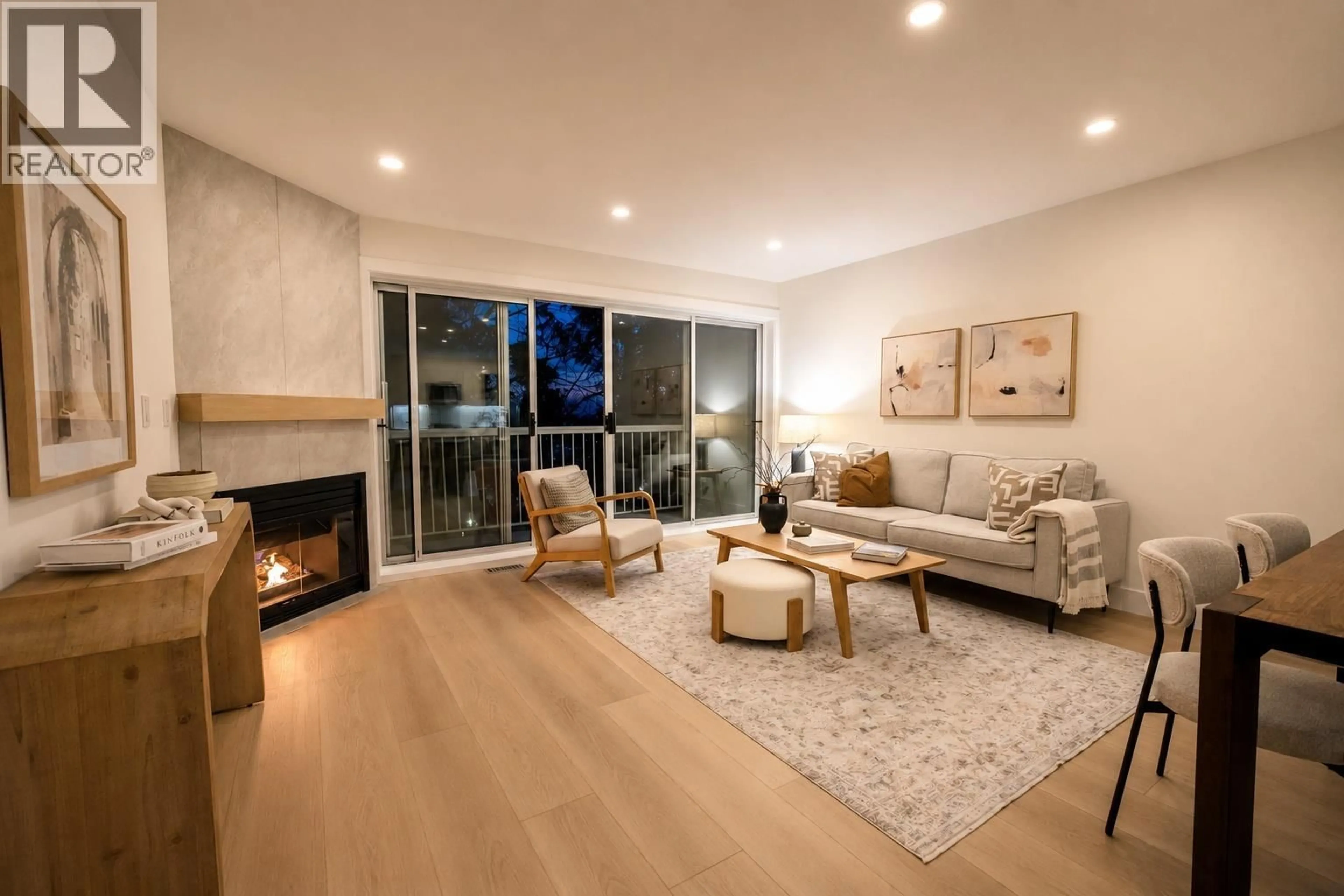 Living room with furniture, wood/laminate floor for 3350 COBBLESTONE AVENUE, Vancouver British Columbia V5S4S4