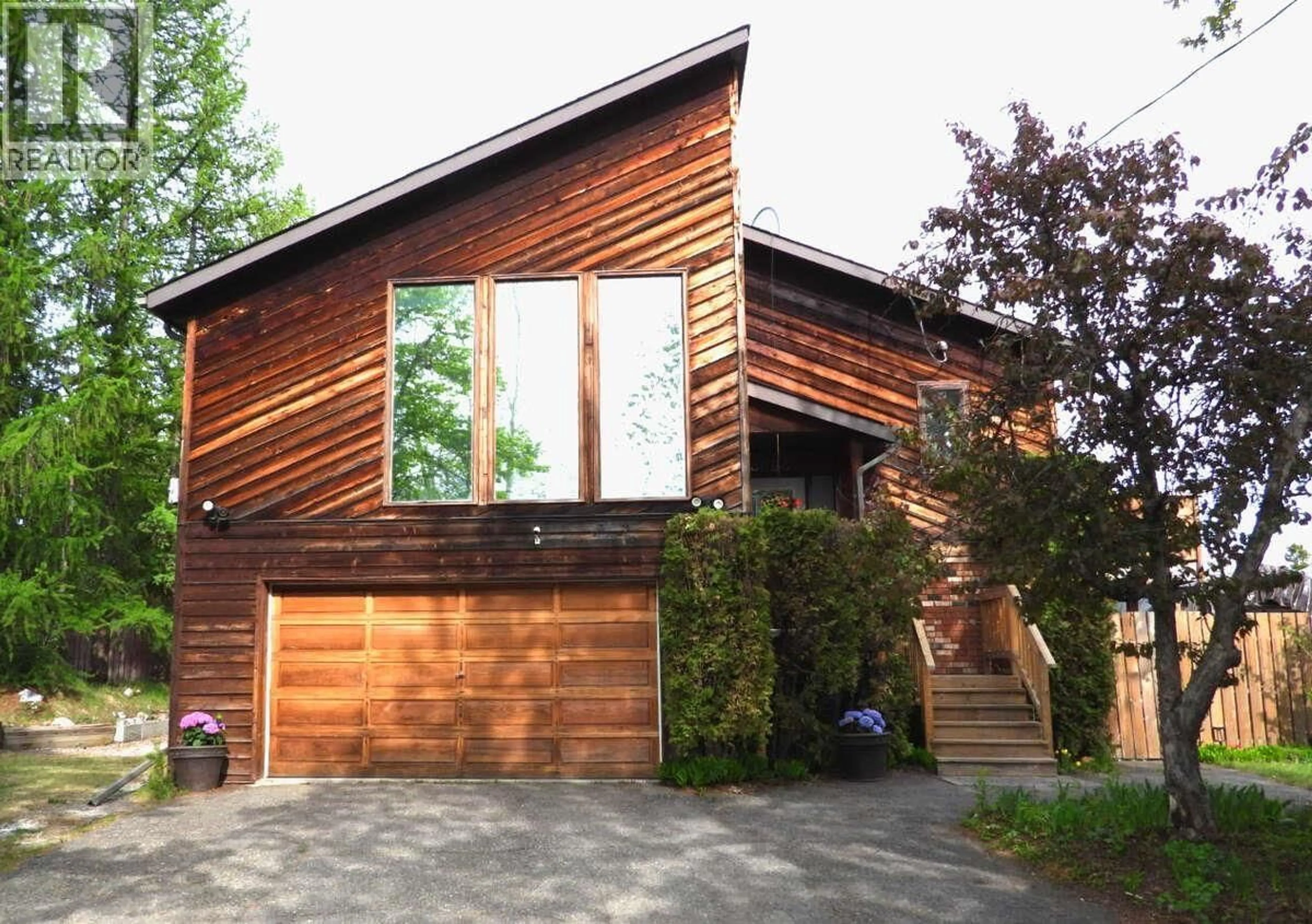 Home with brick exterior material, street for 3696 ROSIA ROAD, Prince George British Columbia V2K4Y6