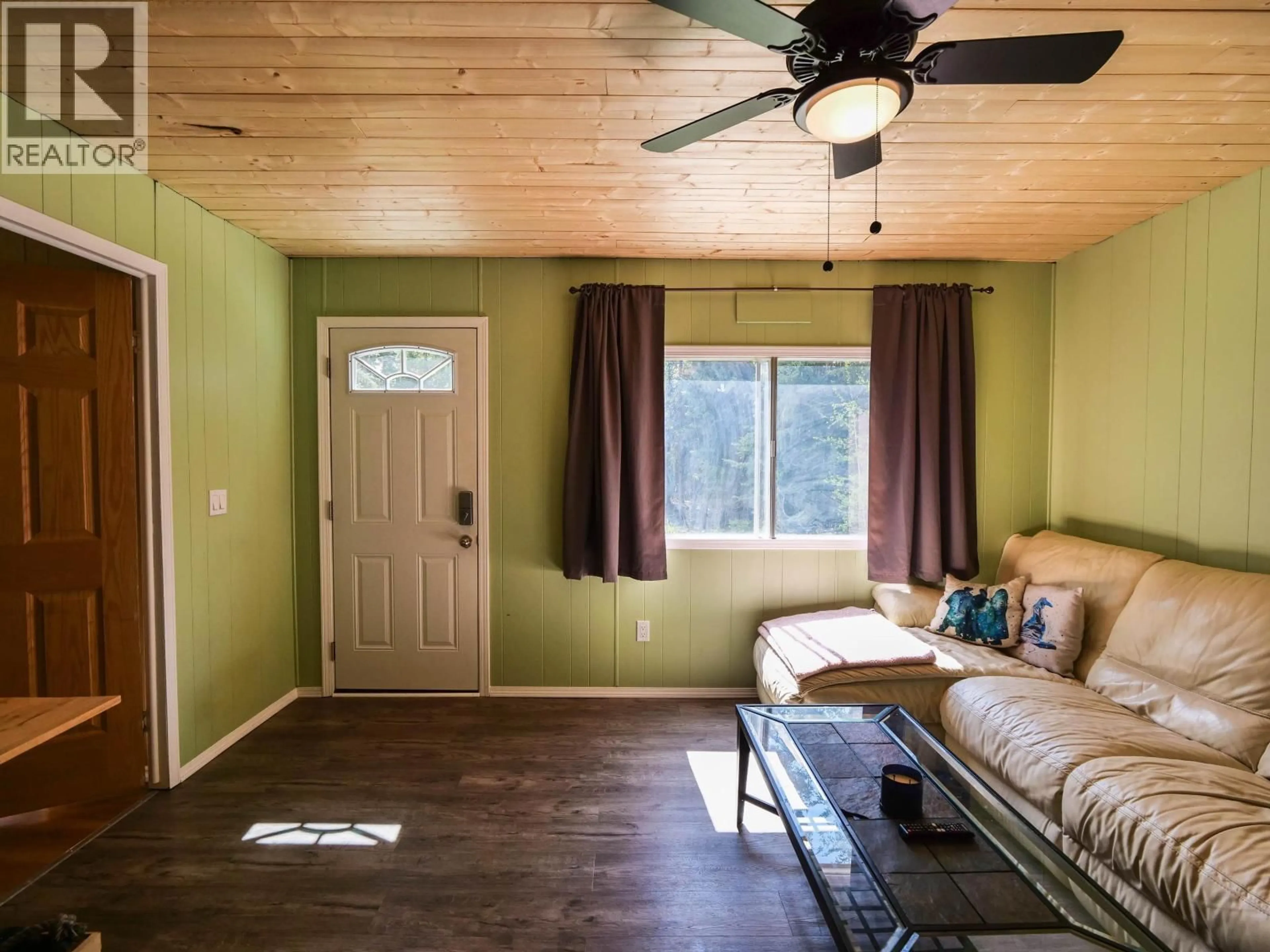 Living room with furniture, wood/laminate floor for 2407 VERNON ROAD, Quesnel British Columbia V2J7C8