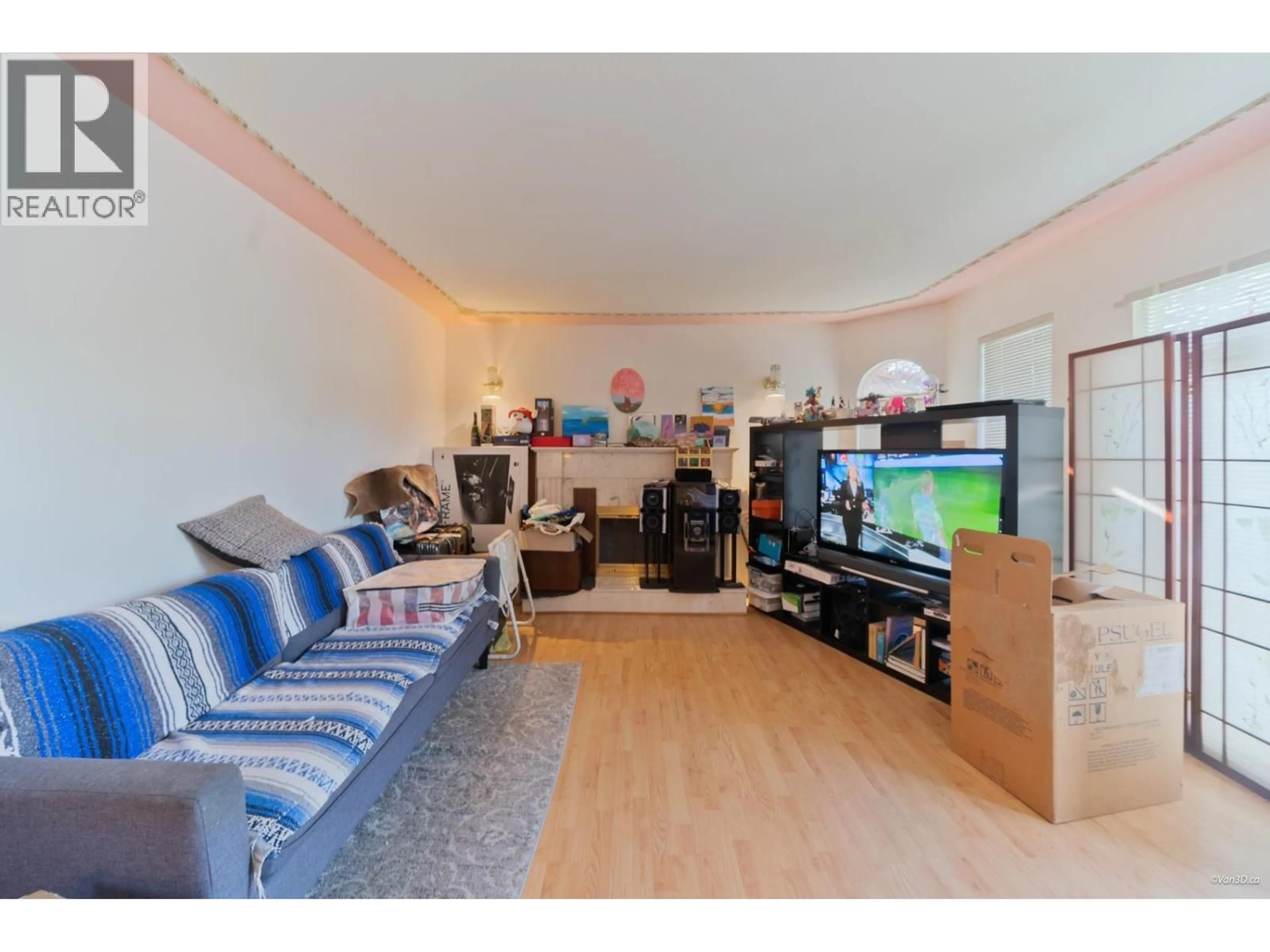 Living room with furniture, wood/laminate floor for 4366 VENABLES STREET, Burnaby British Columbia V5C3A2