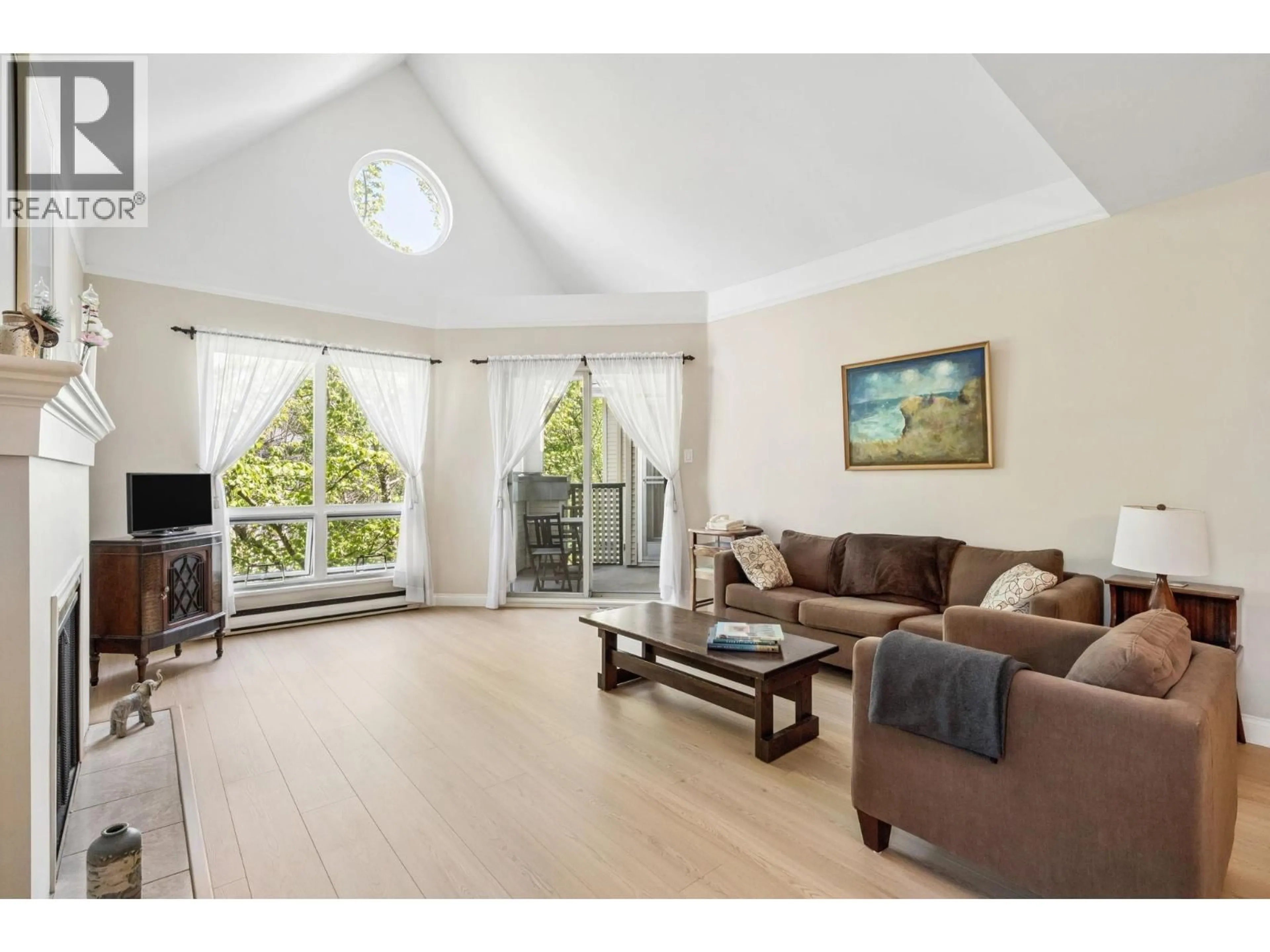 Living room with furniture, wood/laminate floor for 305 - 7459 MOFFATT ROAD, Richmond British Columbia V6Y1X9