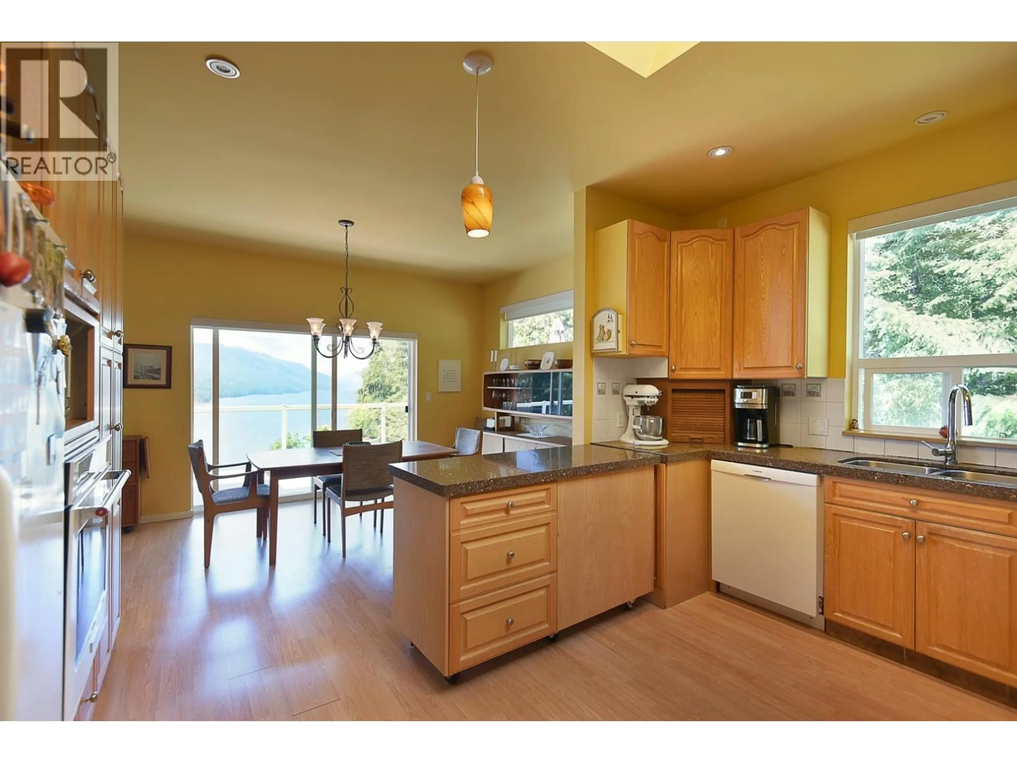Open concept kitchen, ceramic/tile floor for 5870 SKOOKUMCHUK ROAD, Sechelt British Columbia V7Z0P3