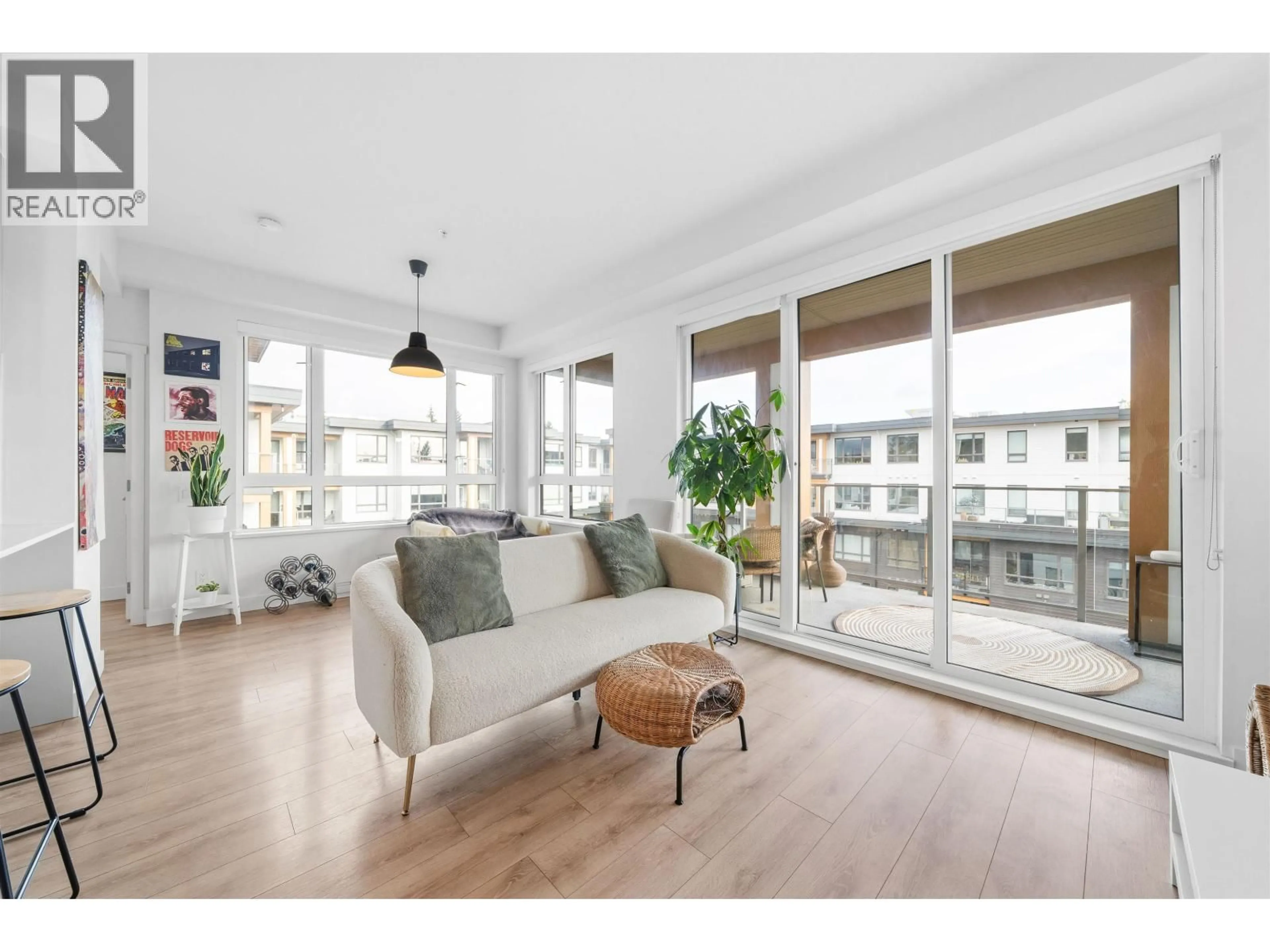 Living room with furniture, wood/laminate floor for 613 - 735 ANSKAR COURT, Coquitlam British Columbia V3J0L7
