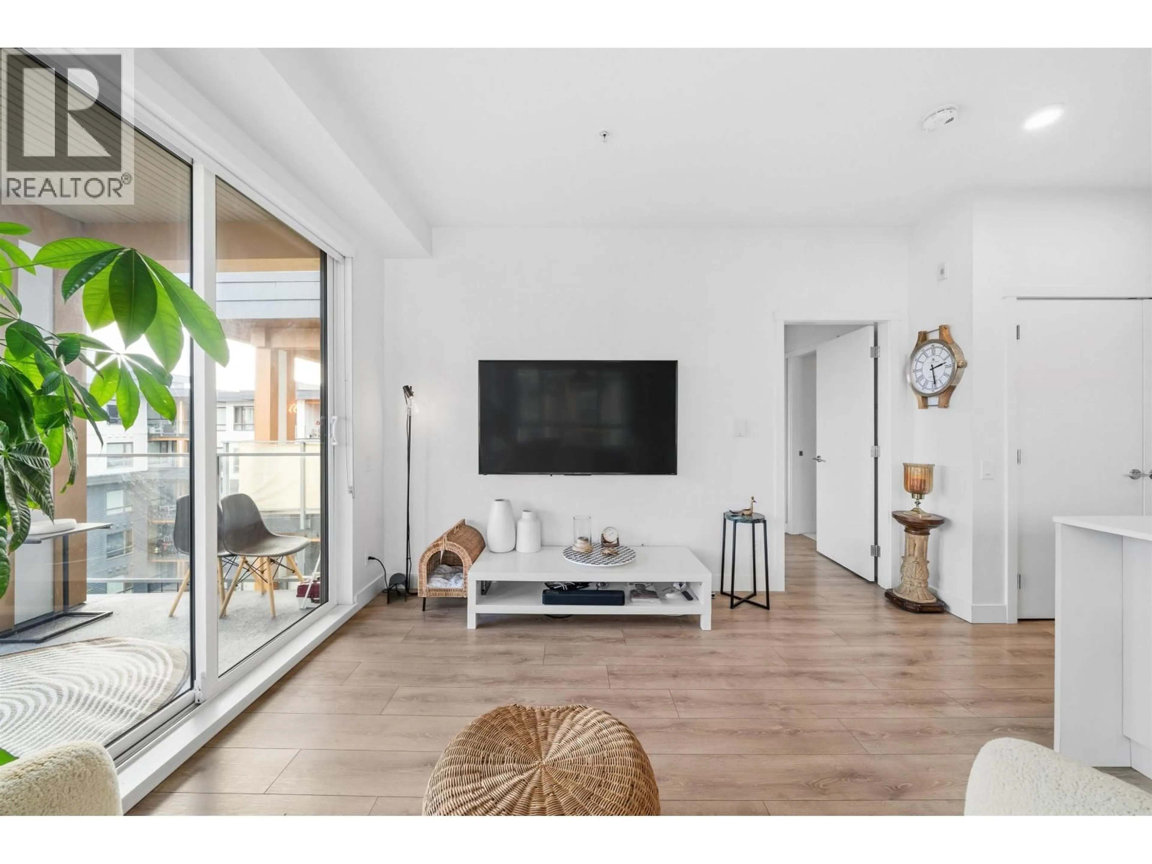 Living room with furniture, wood/laminate floor for 613 - 735 ANSKAR COURT, Coquitlam British Columbia V3J0L7