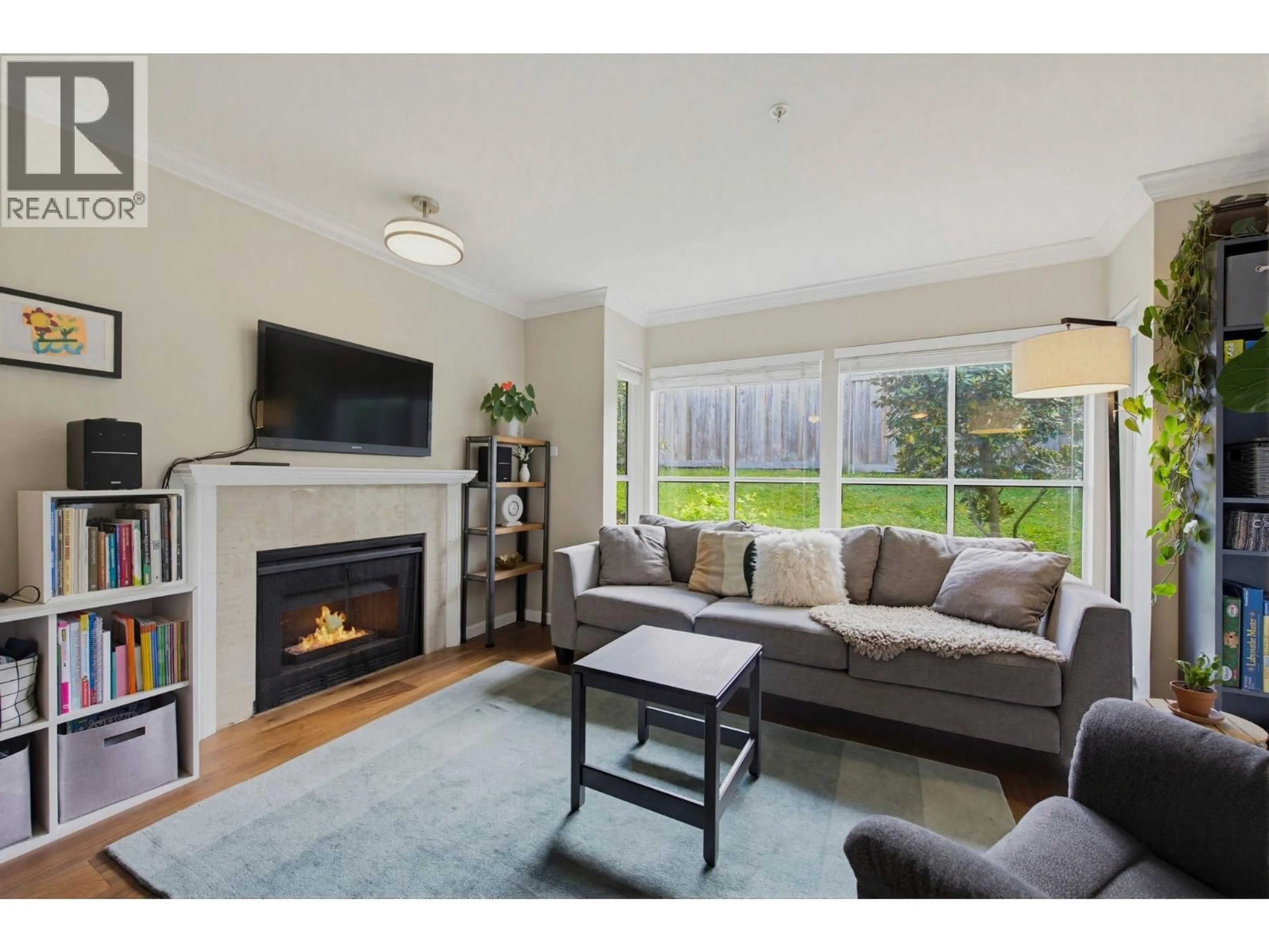 Living room with furniture, wood/laminate floor for 111 - 2960 29TH AVENUE, Vancouver British Columbia V5R5Z5