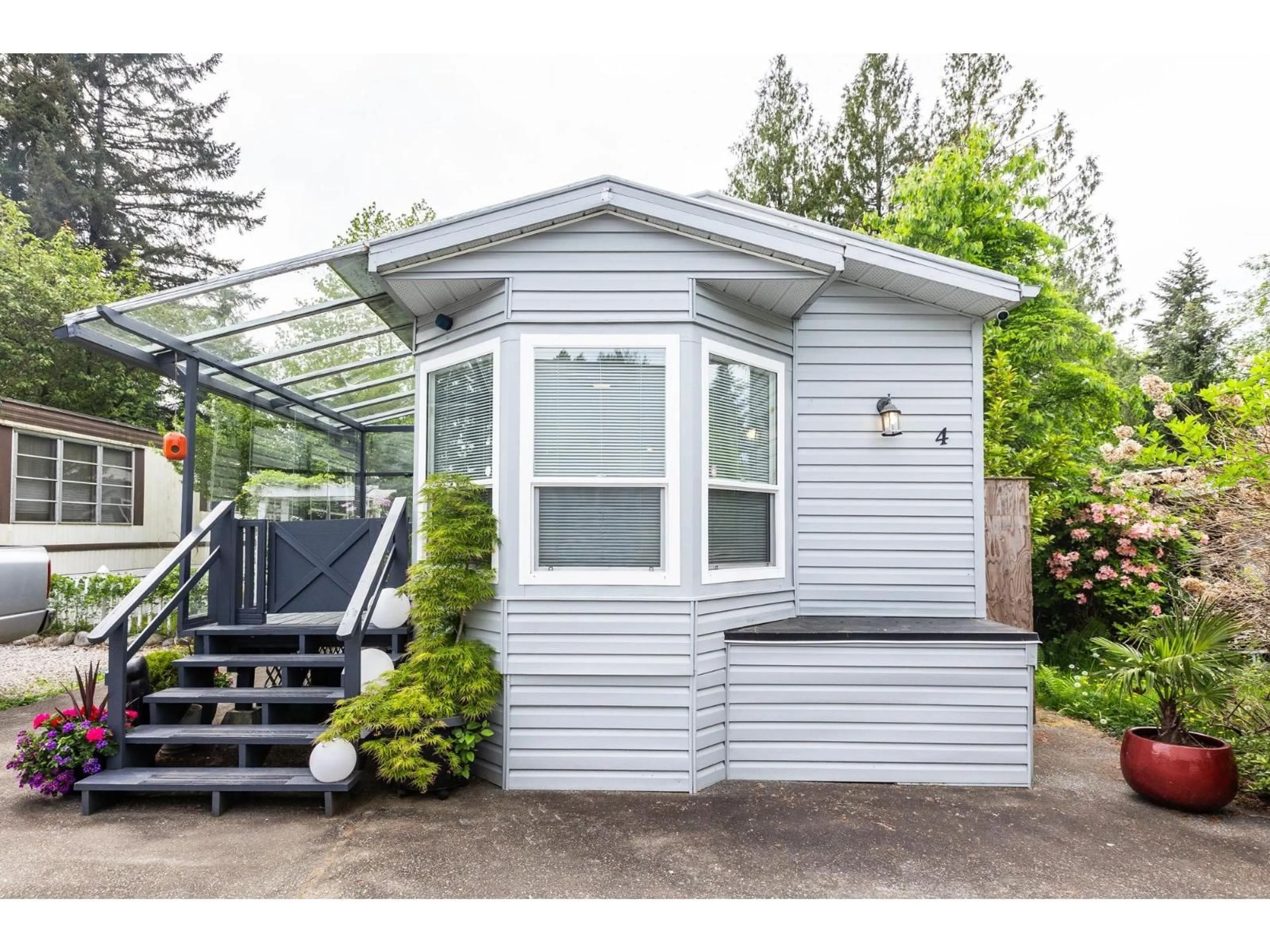 Home with vinyl exterior material, street for 4 - 23387 70A AVENUE, Langley British Columbia V2Y2J2