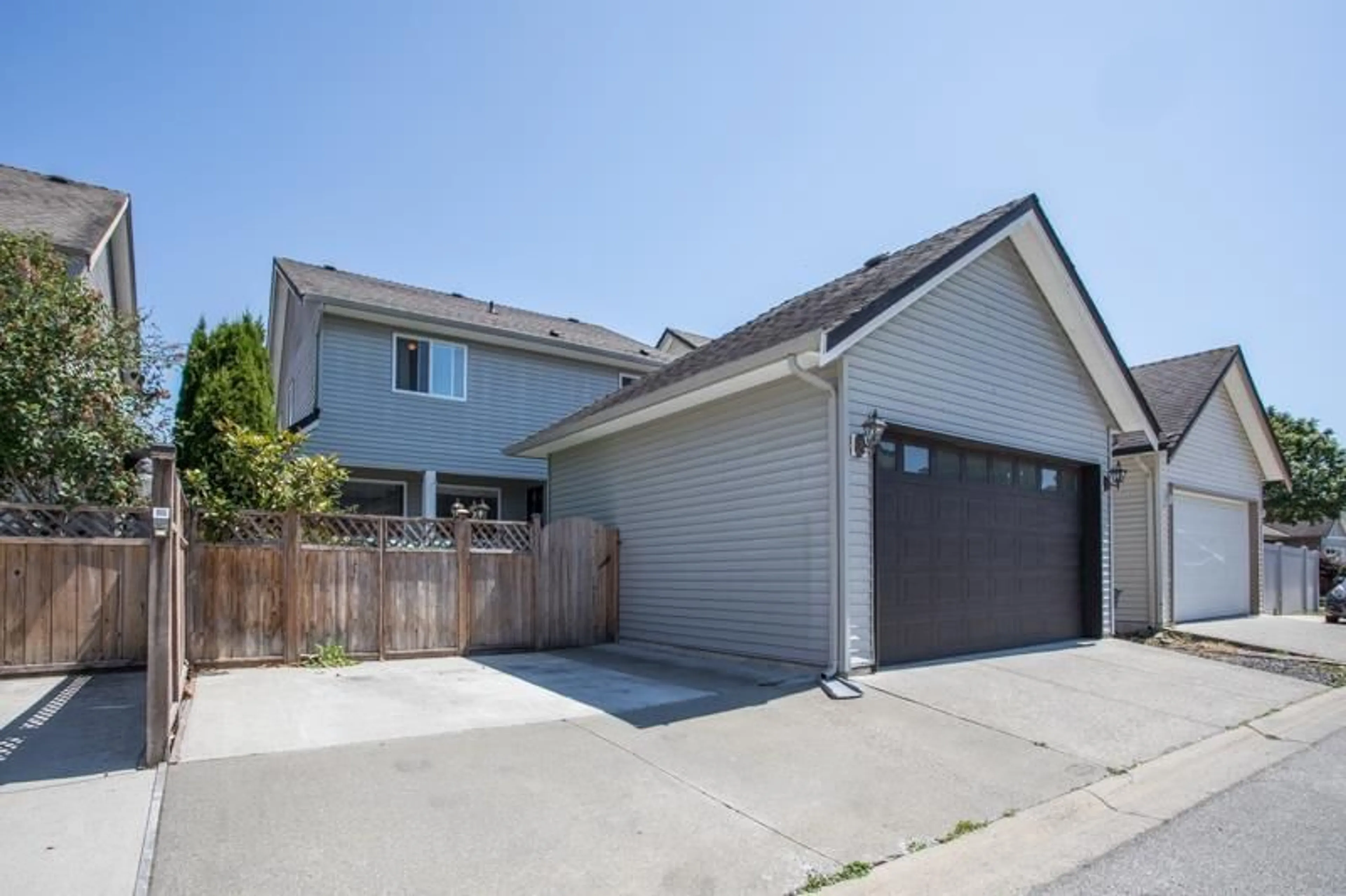 Home with vinyl exterior material, street for 7015 195 STREET, Surrey British Columbia V4N5Z2